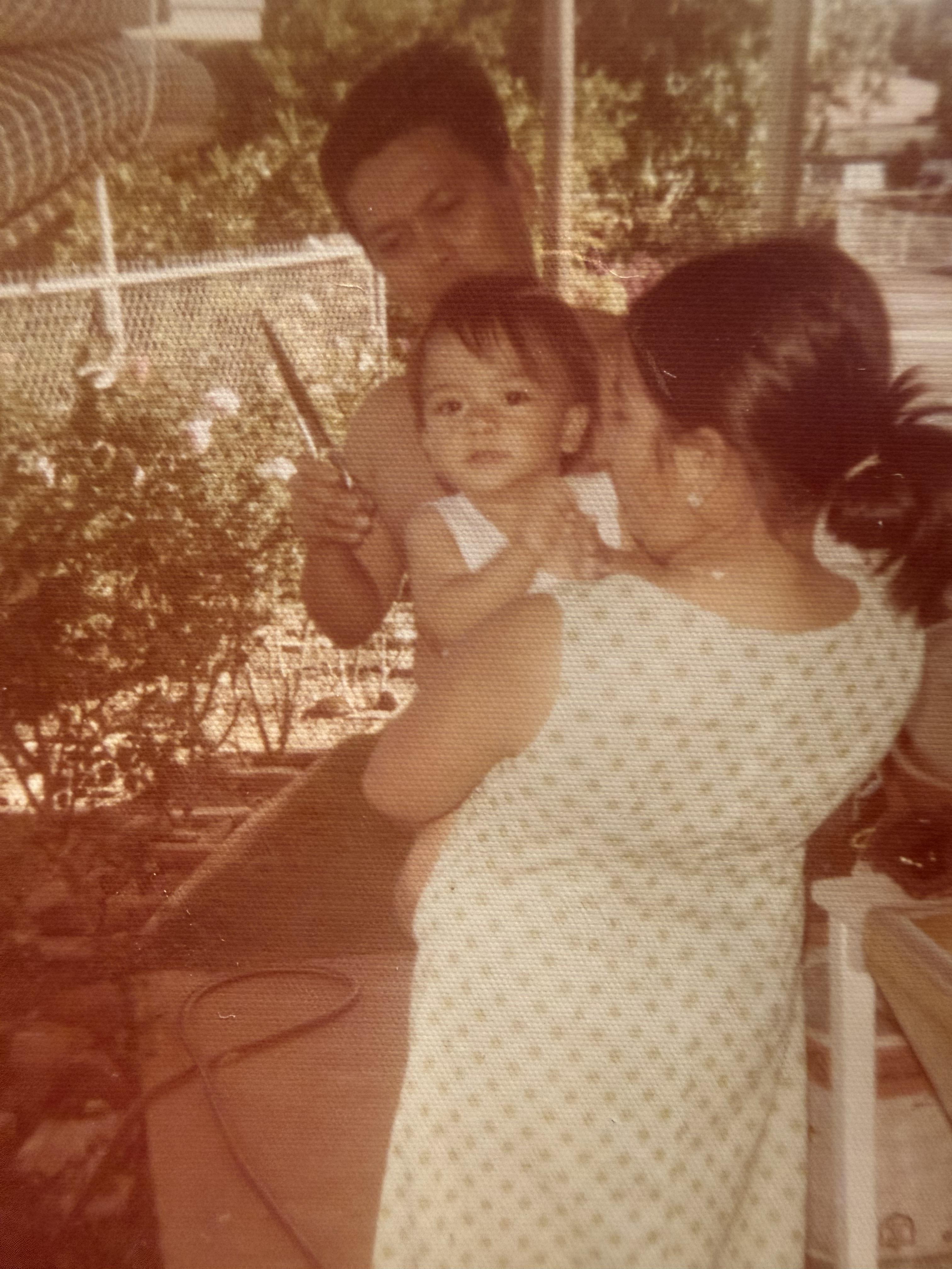 A woman holding a baby