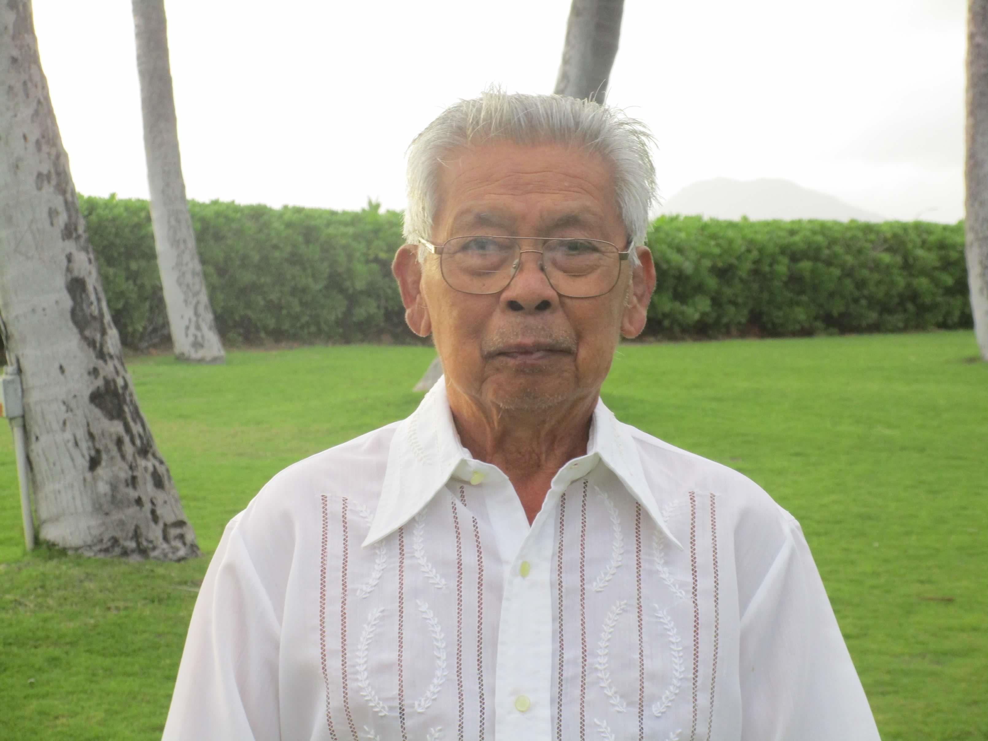 An old man in a white shirt