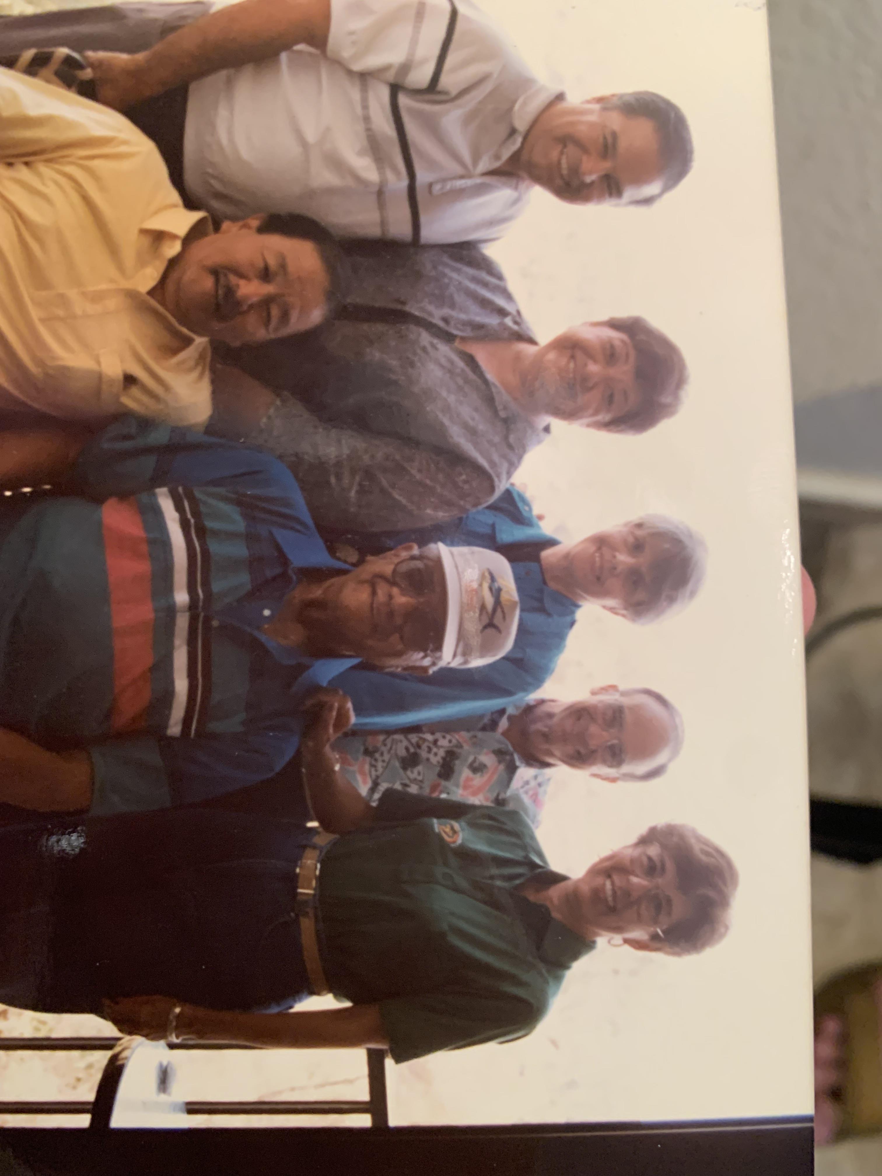 A group of men posing for a photo