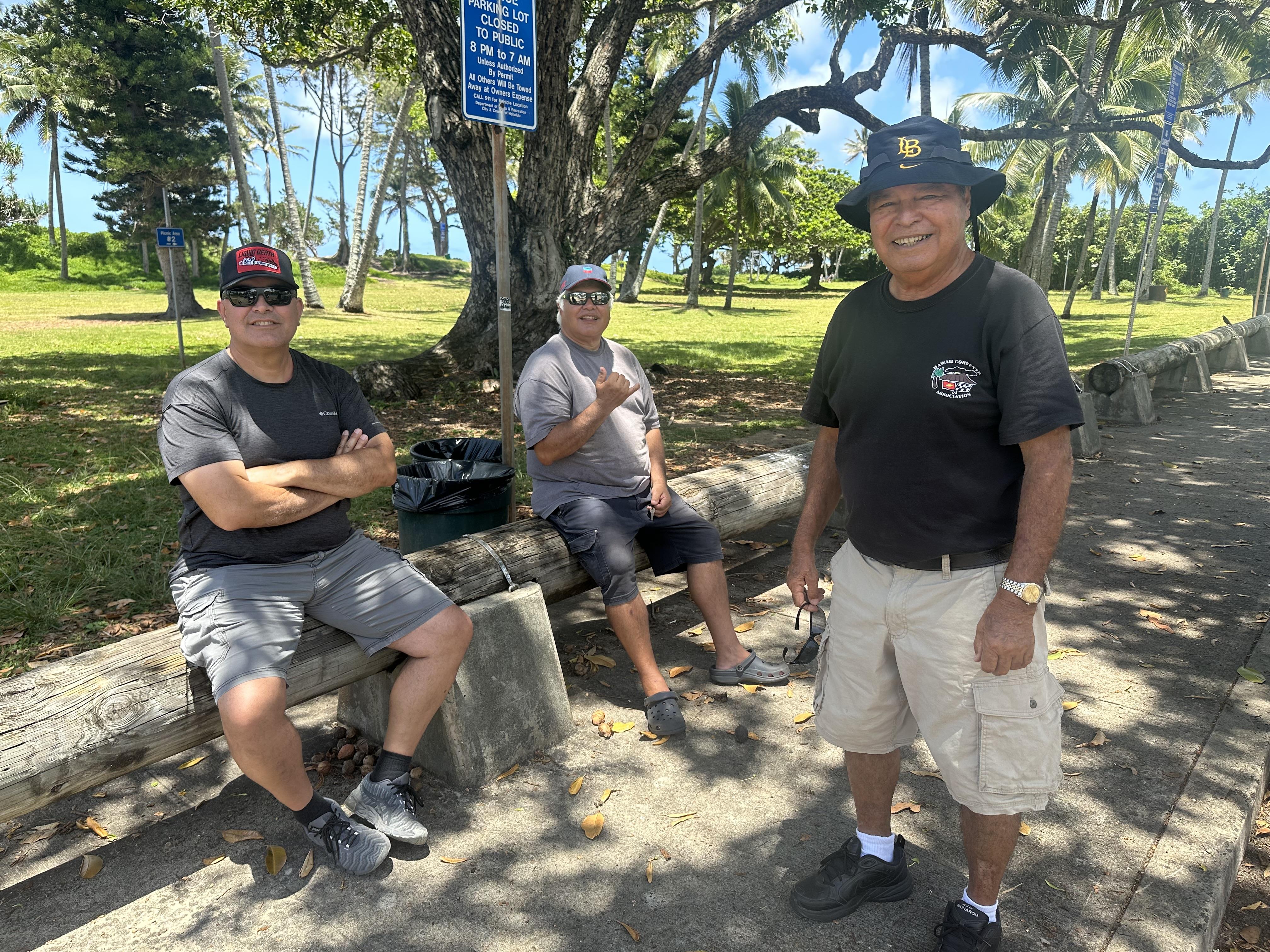 A group of men sitting on a bench