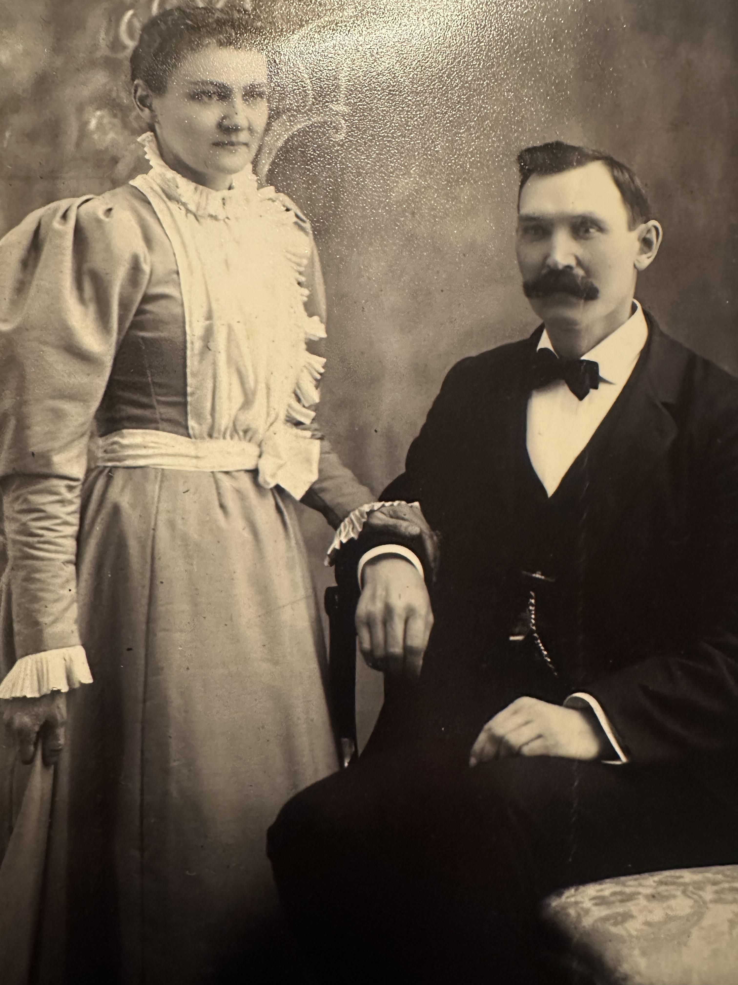 A man and woman posing for a picture