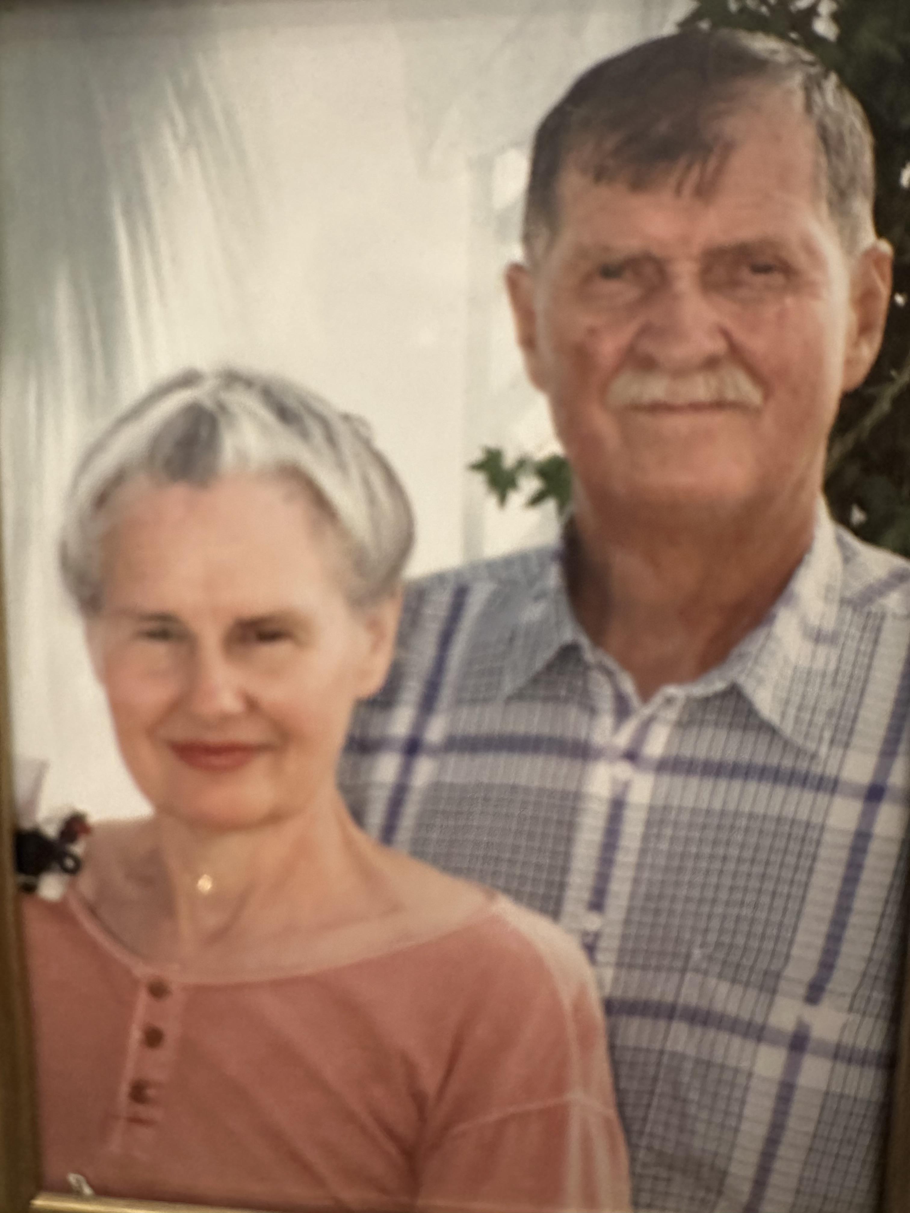 A man and woman posing for a picture