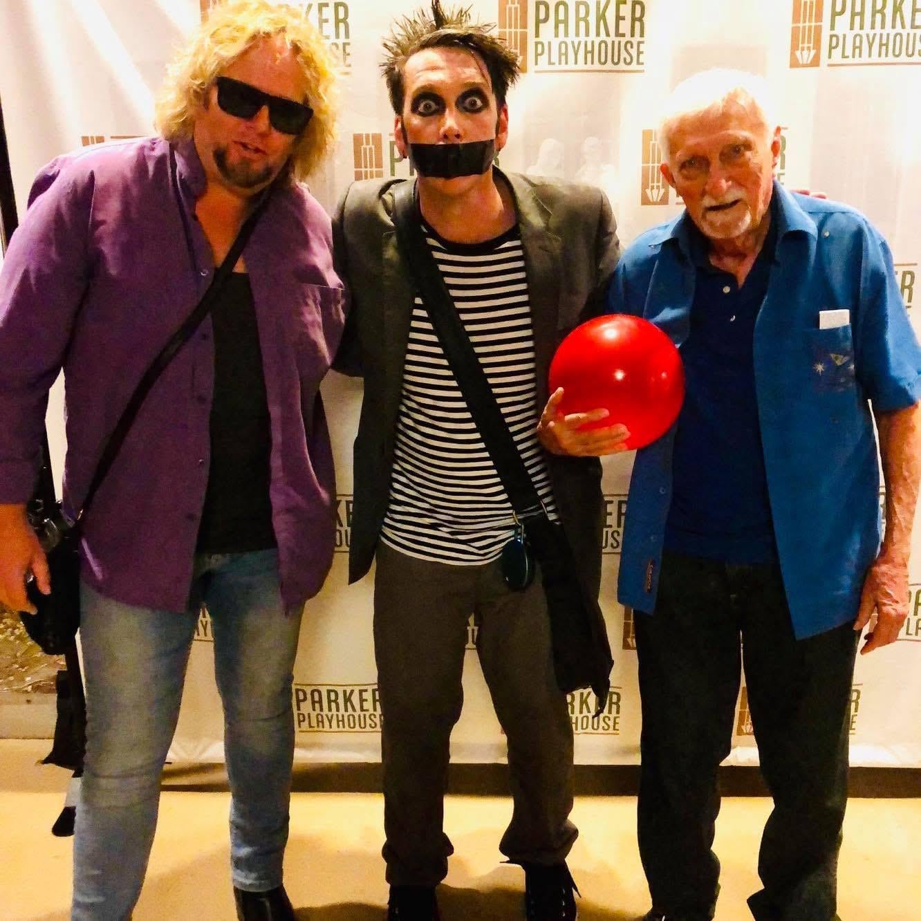 A group of men posing for a picture