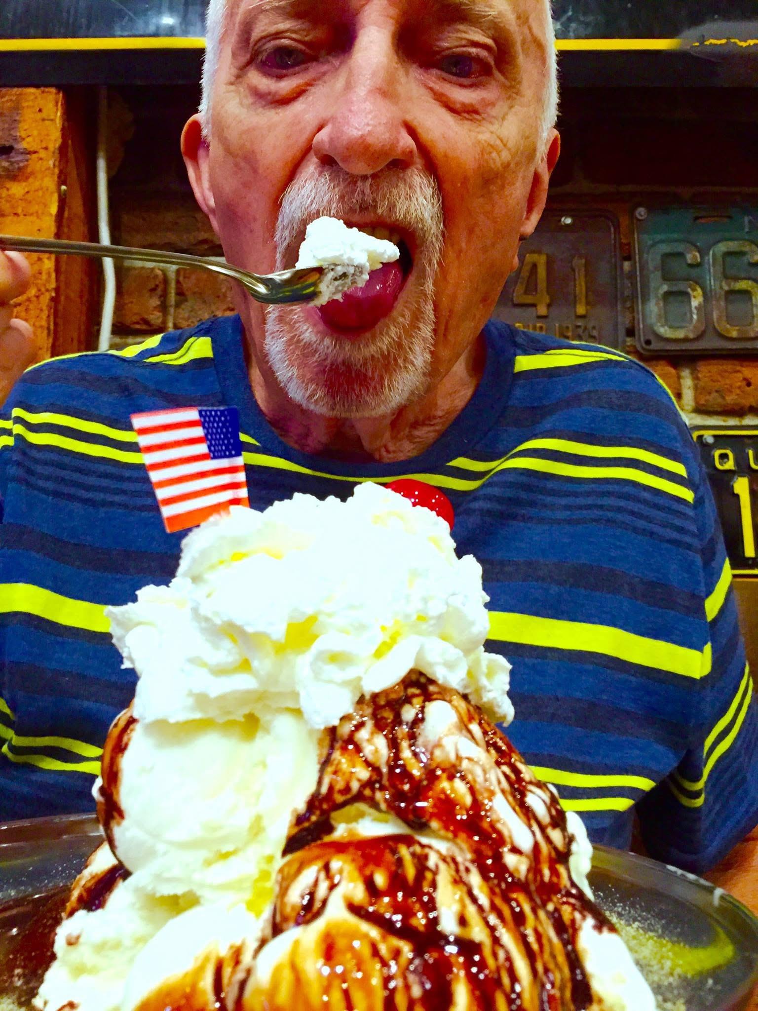 A man eating a dessert