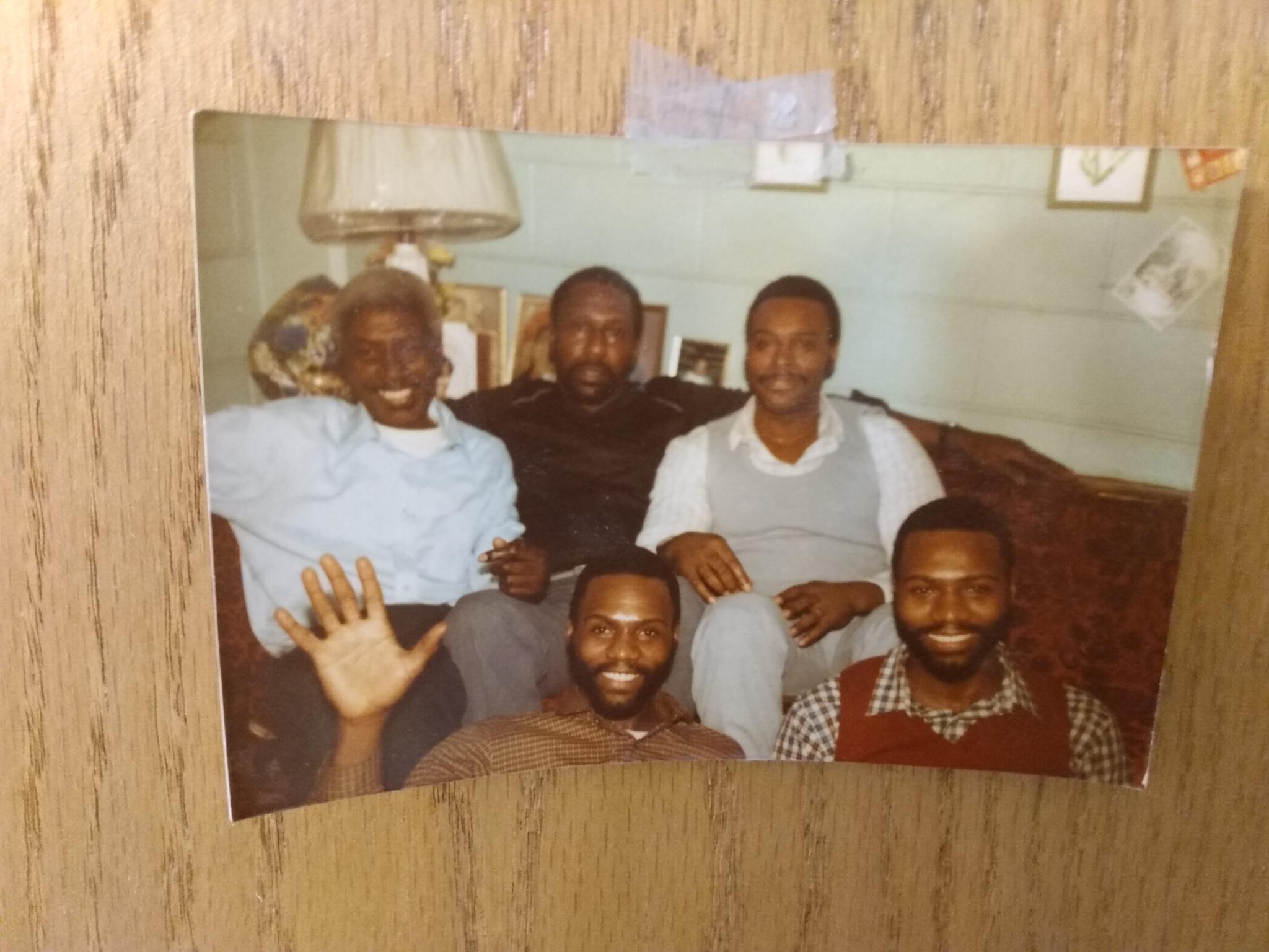 A group of men sitting on a couch