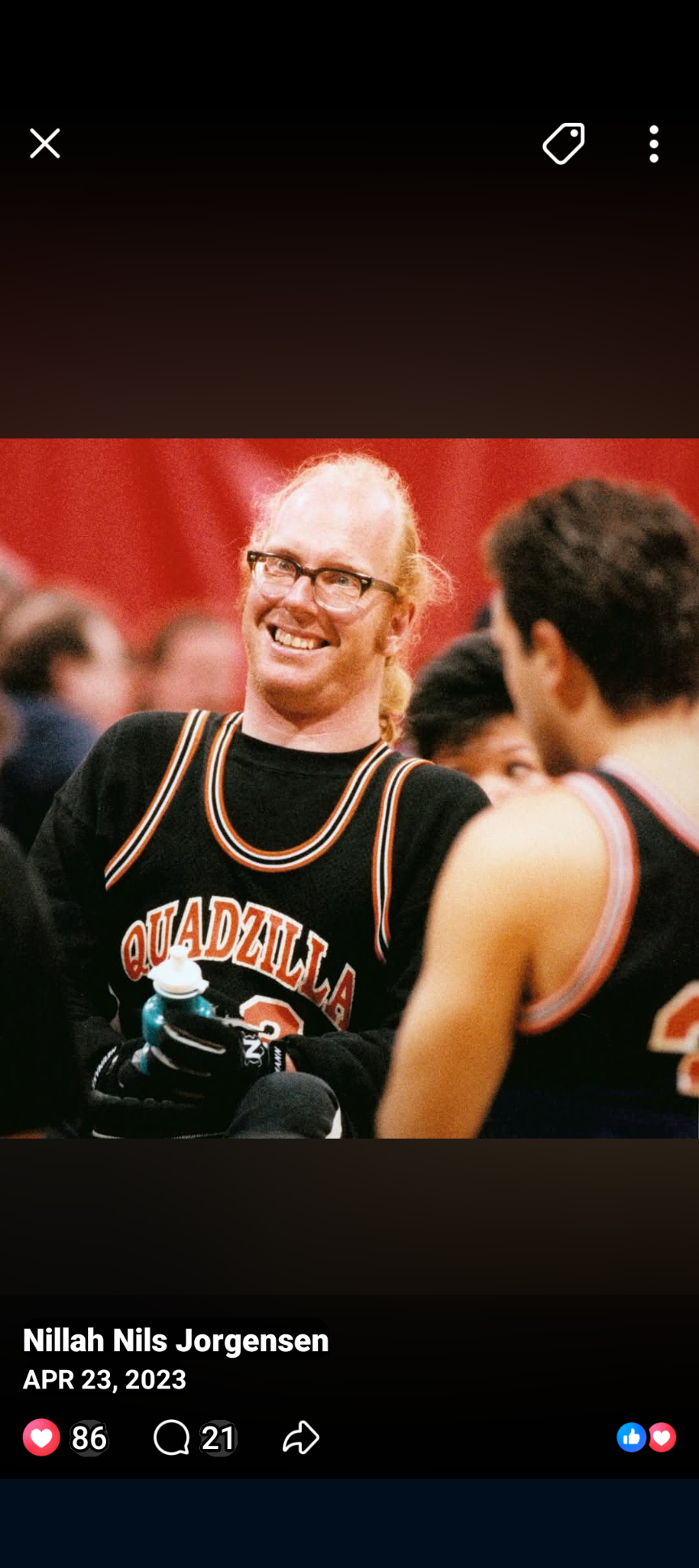 A man in a basketball jersey