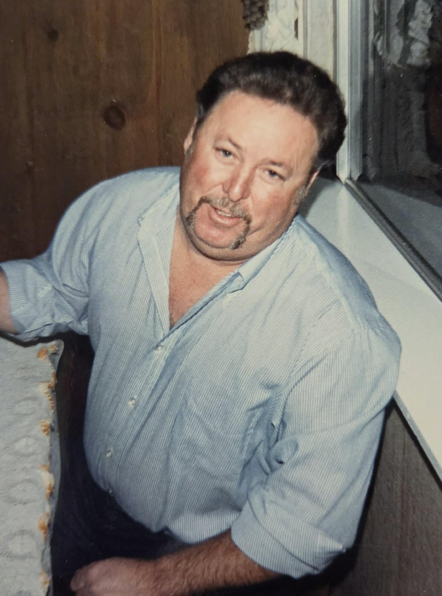 A man with a mustache and beard
