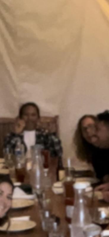 A group of people sitting at a table