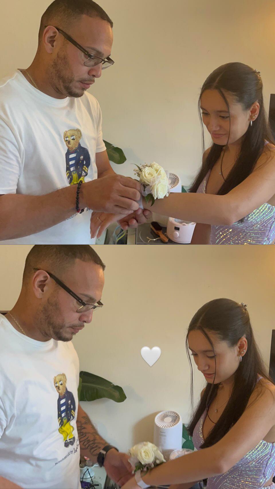A man and woman holding flowers