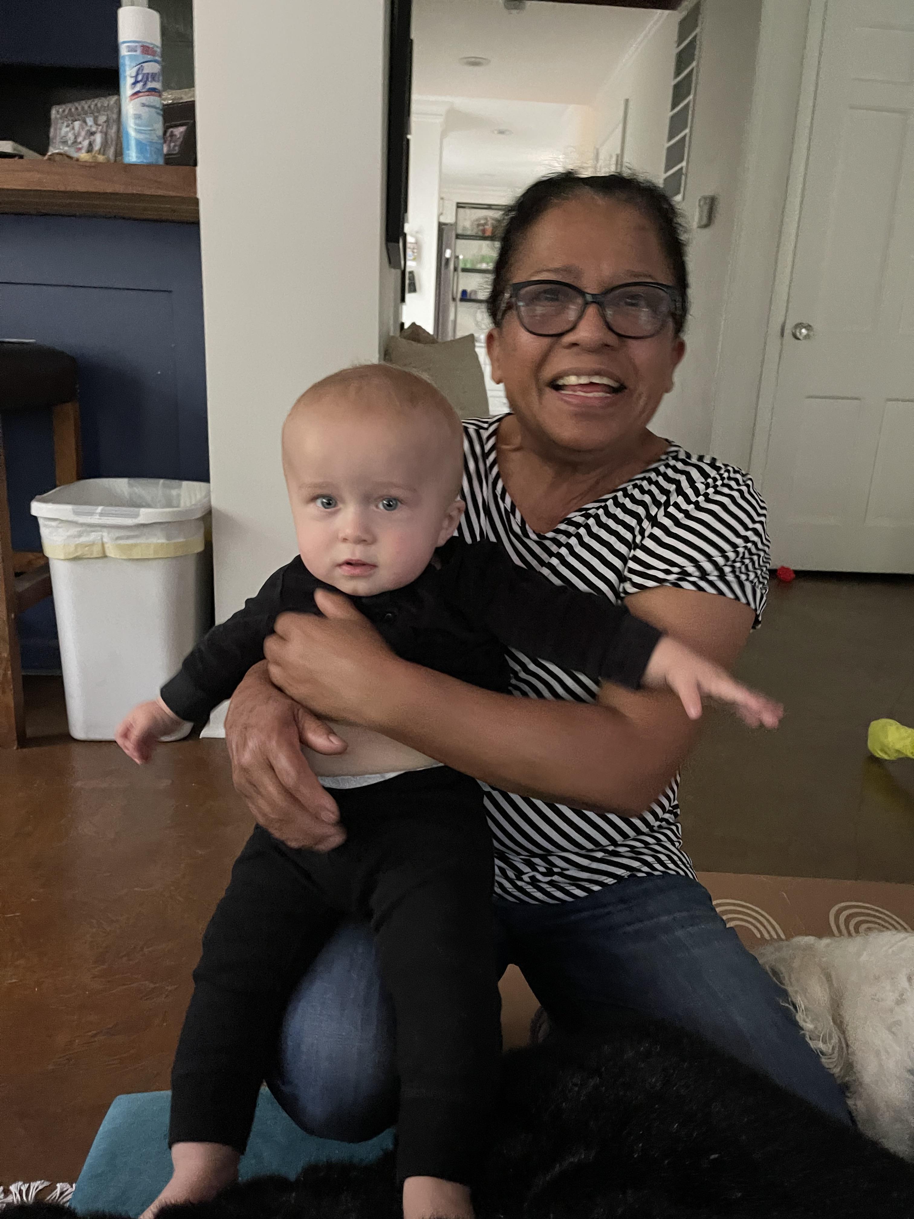 A woman holding a baby
