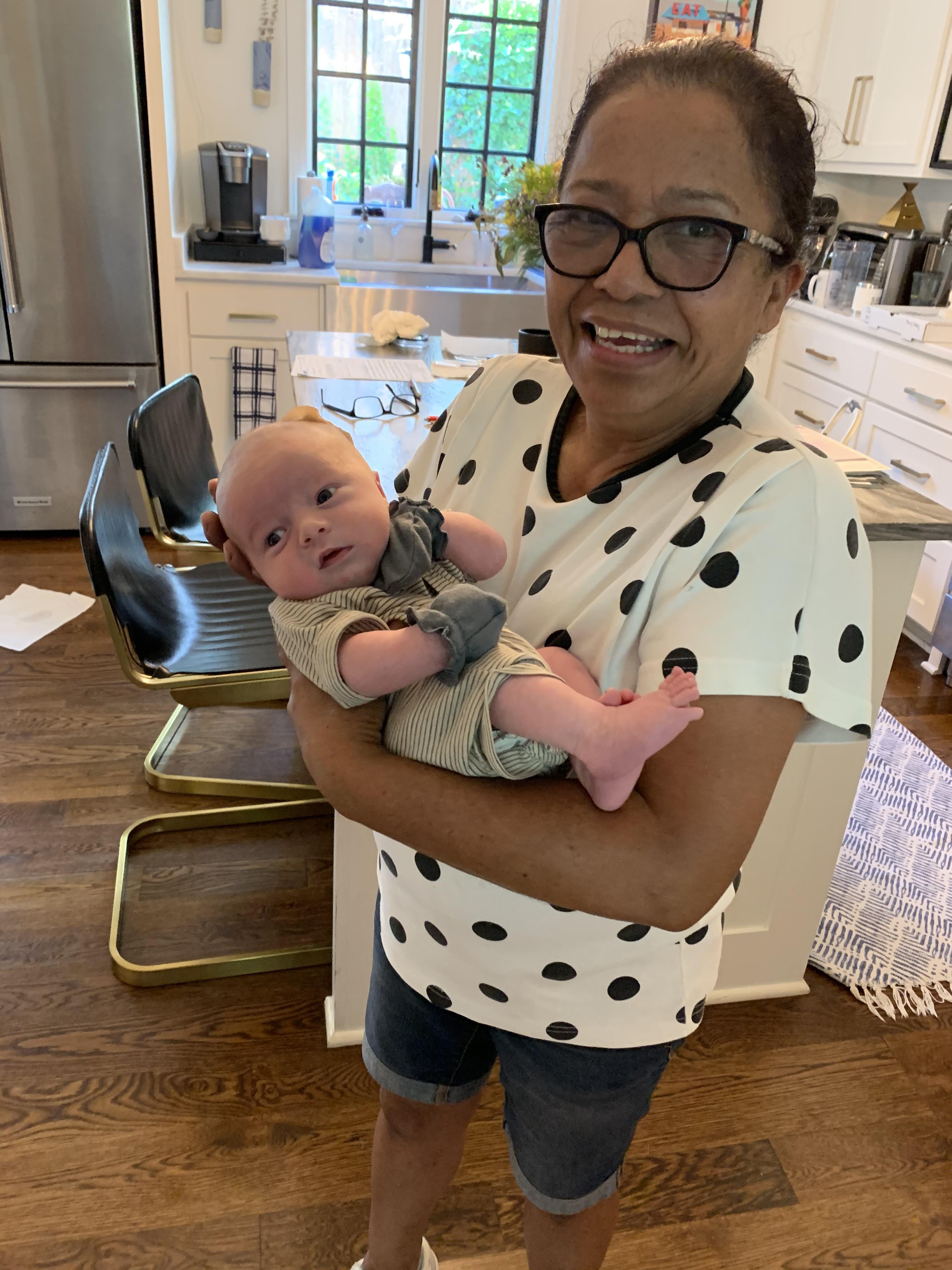 A woman holding a baby
