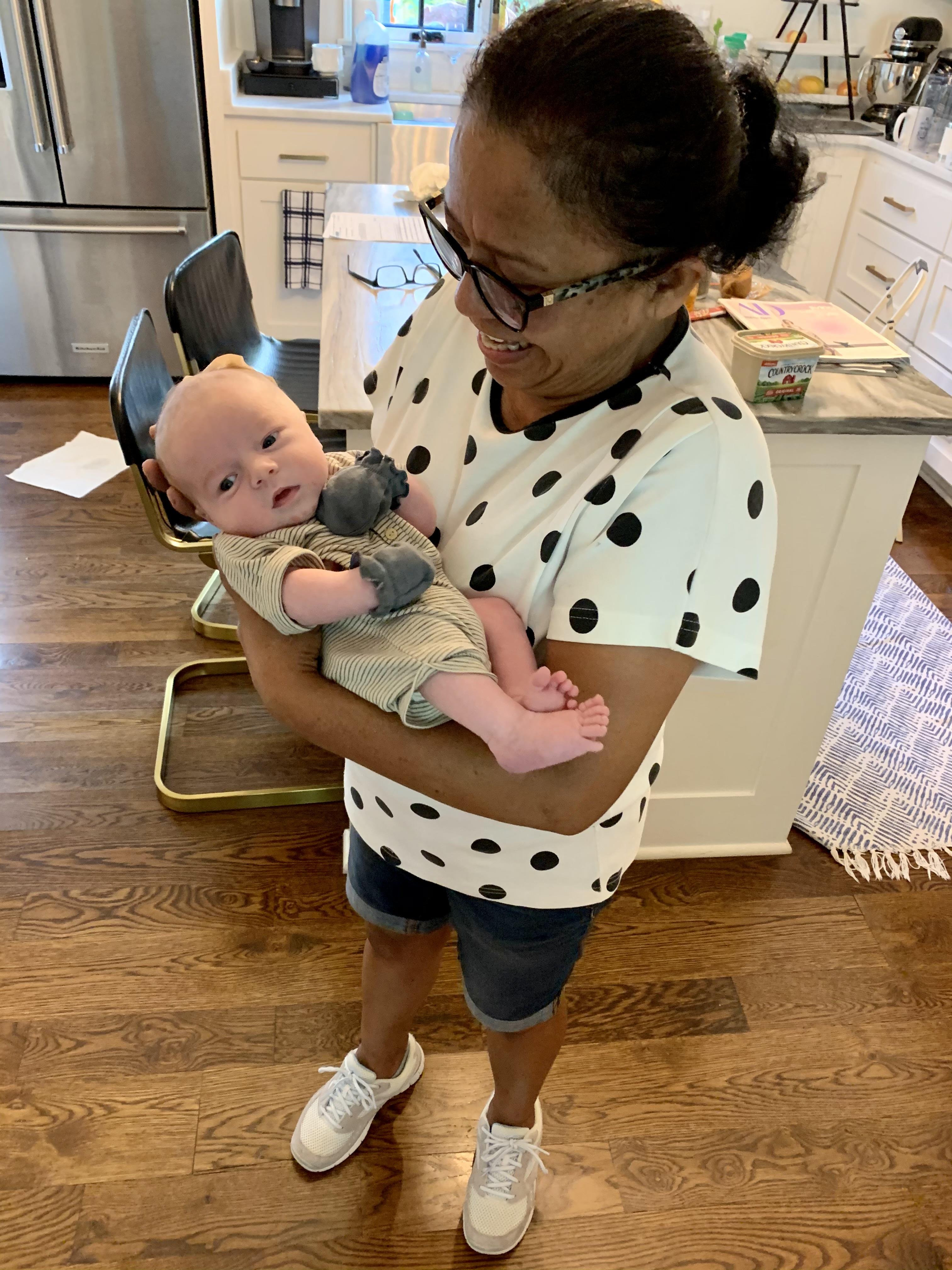A woman holding a baby