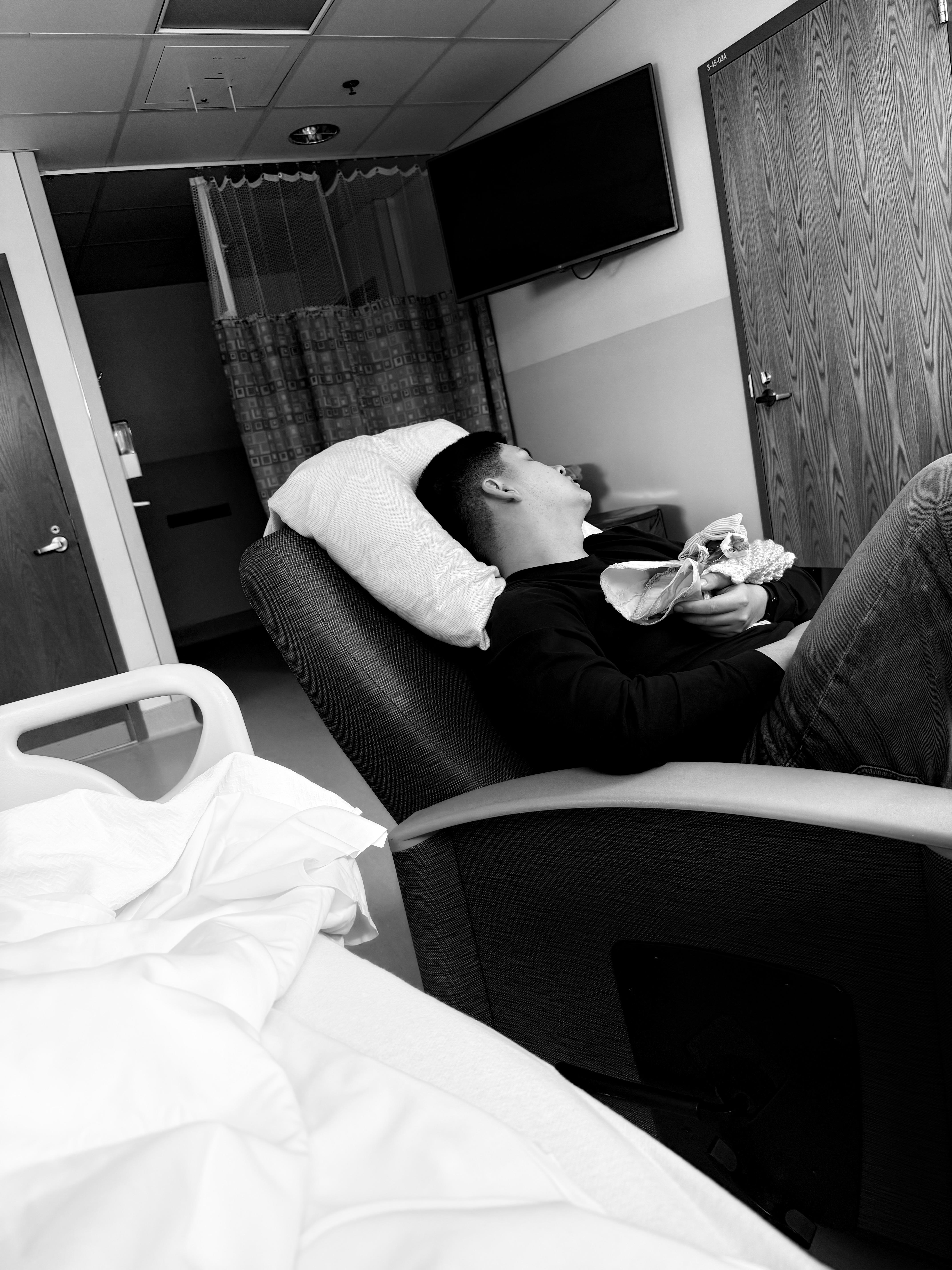 A man lying in a chair