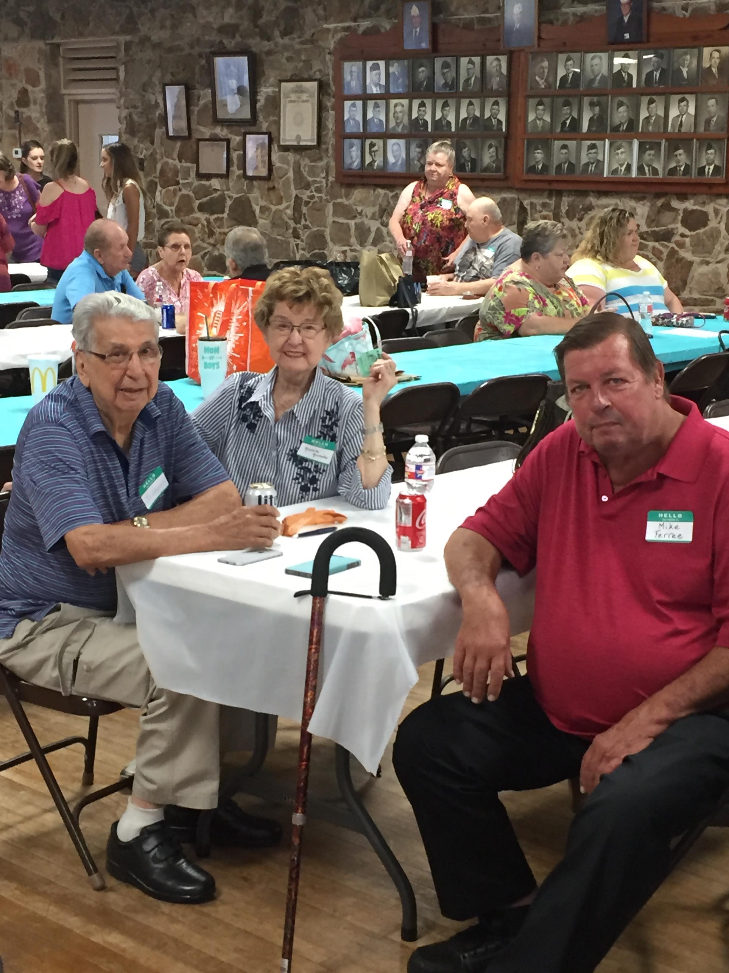 A group of people sitting at a table