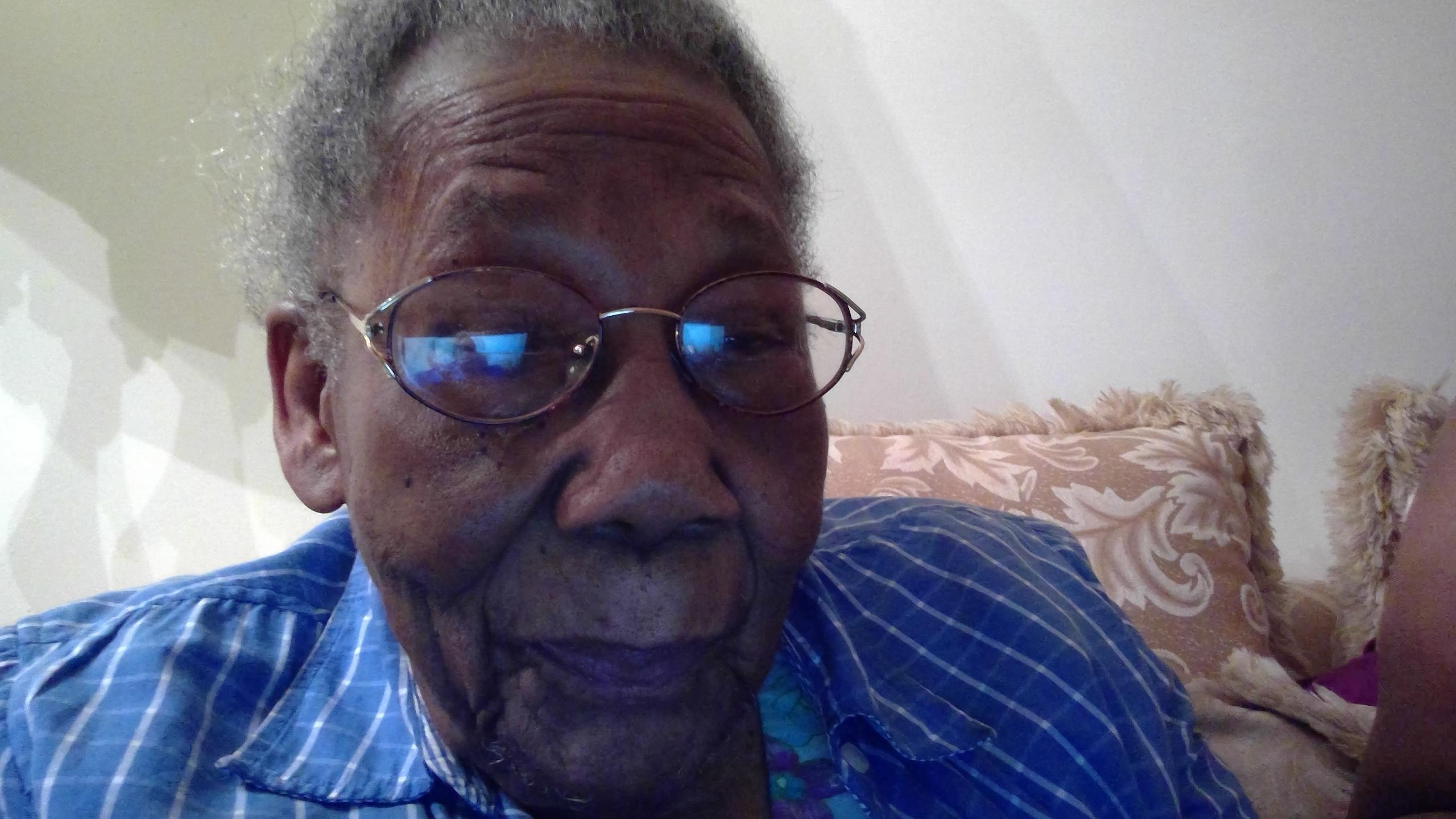 An old woman wearing glasses