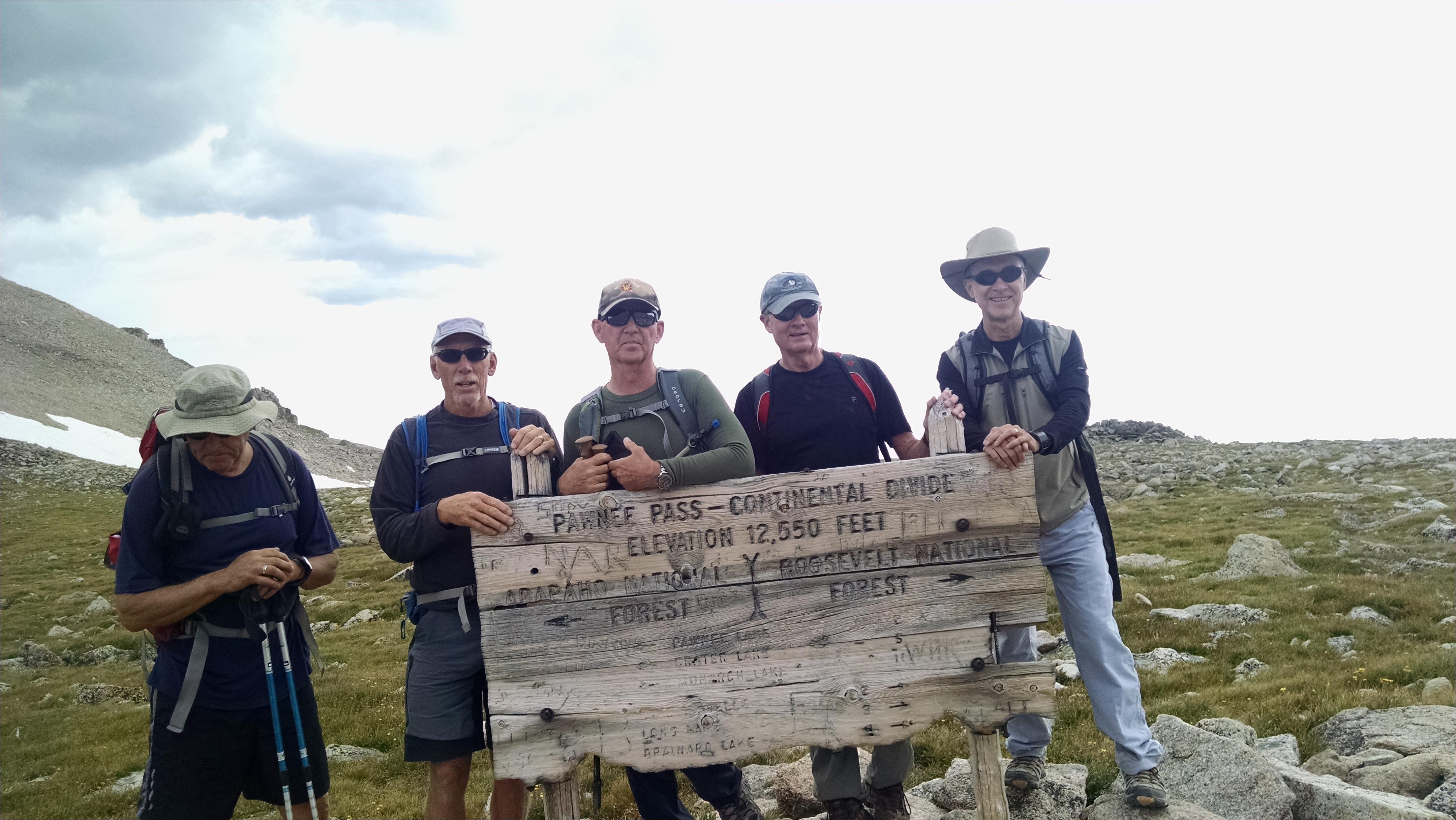 A group of people holding a sign