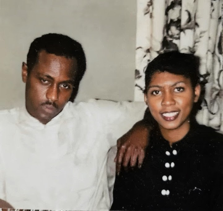 A man and woman posing for a picture