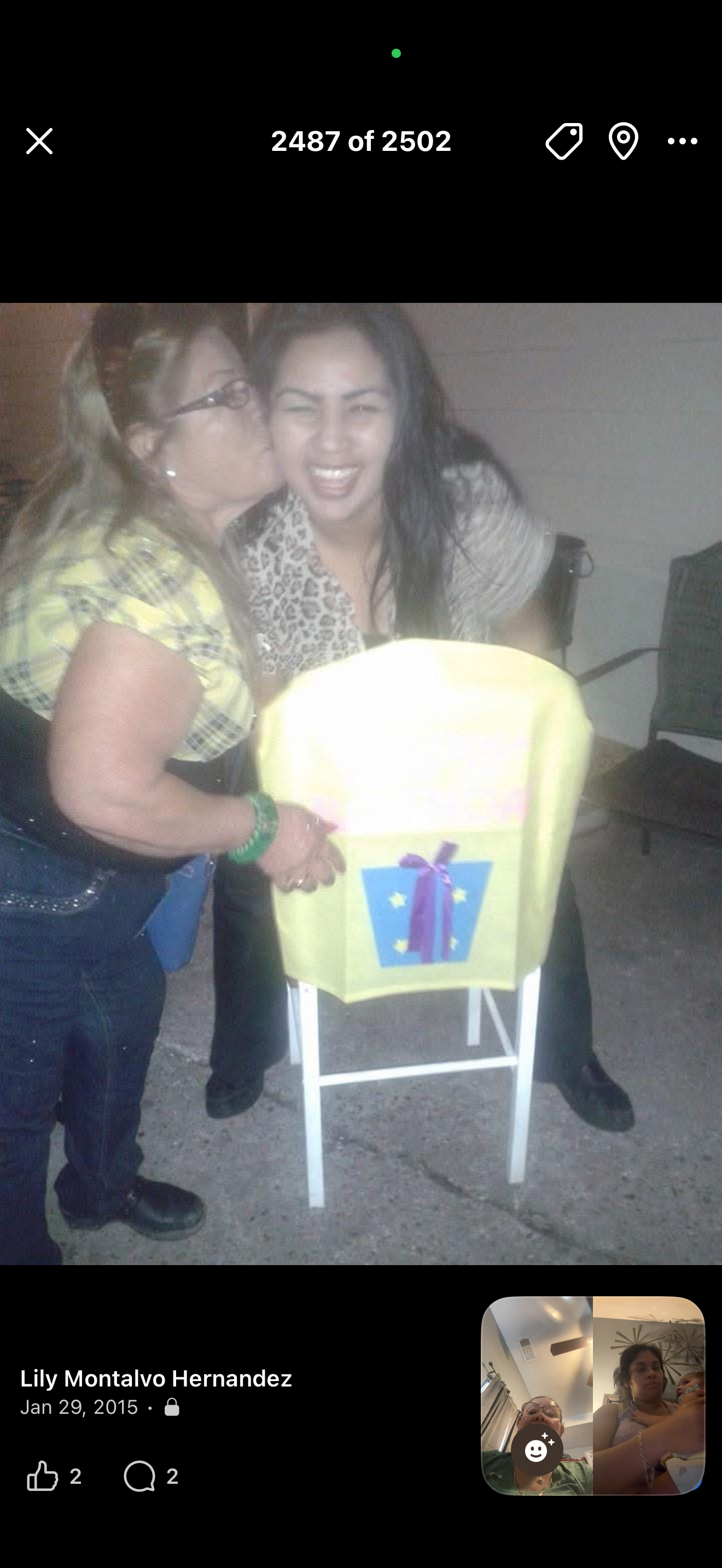 A woman kissing another woman on the cheek