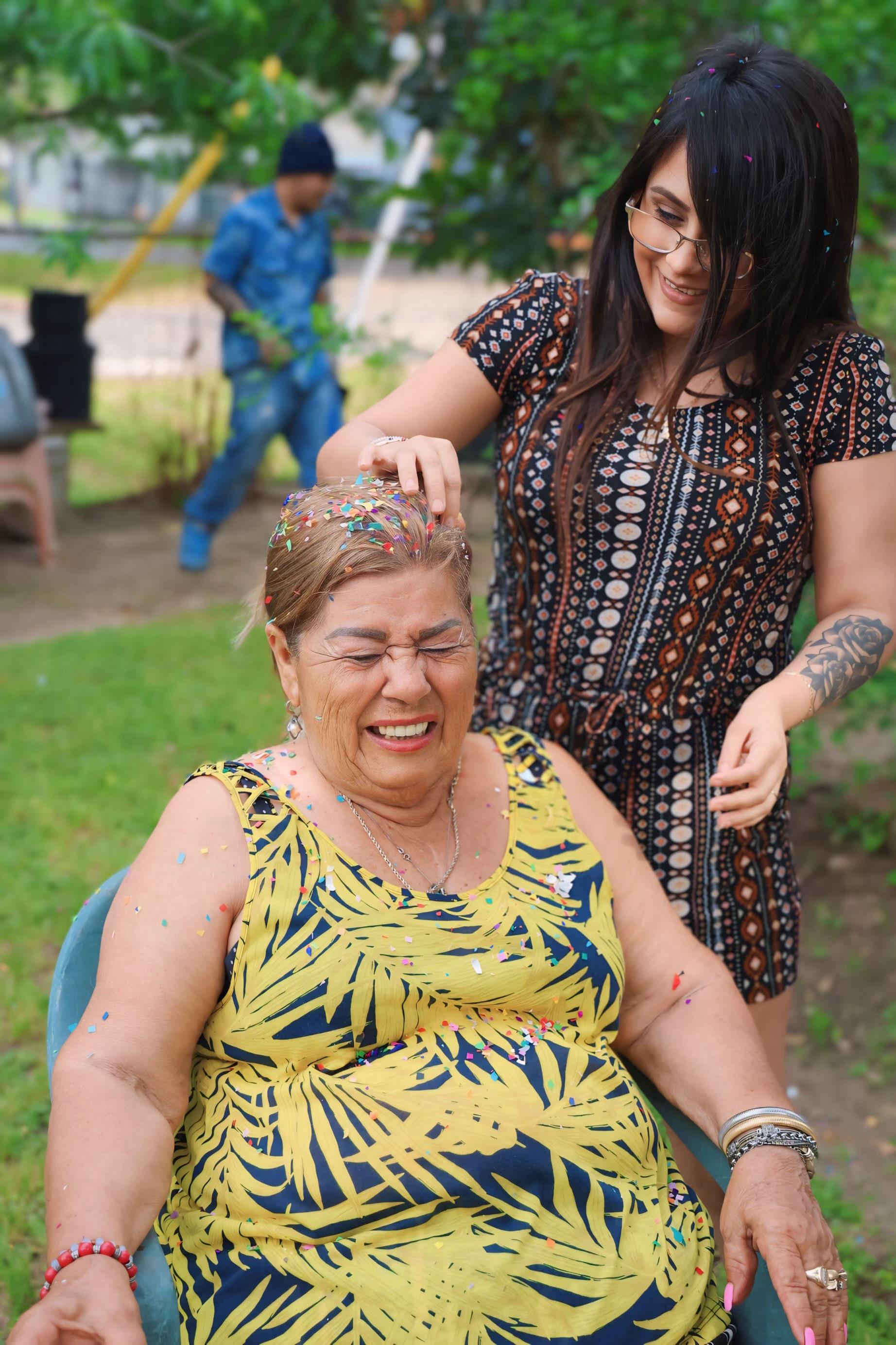 A woman with confetti on her head