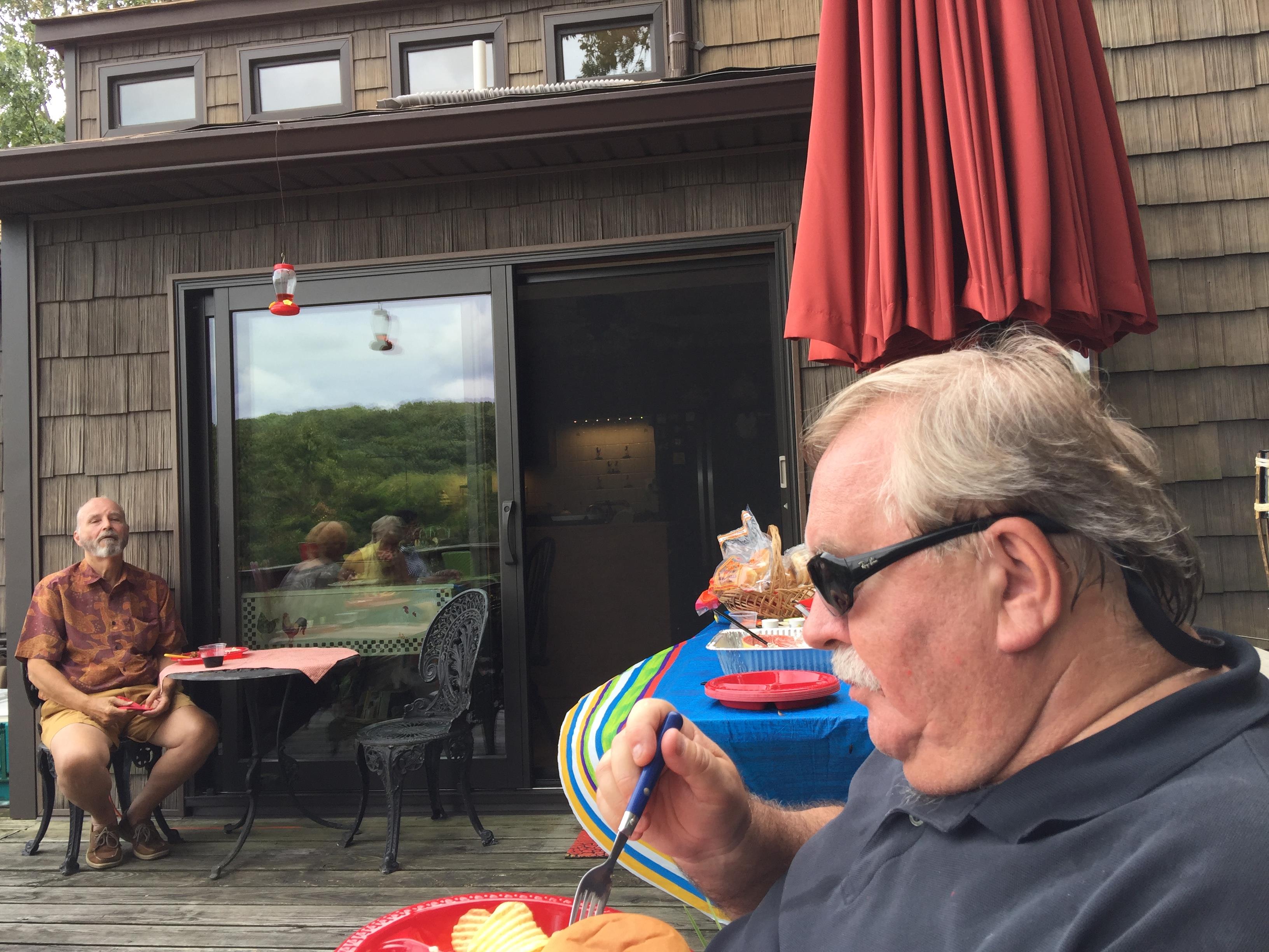 A man sitting outside a restaurant