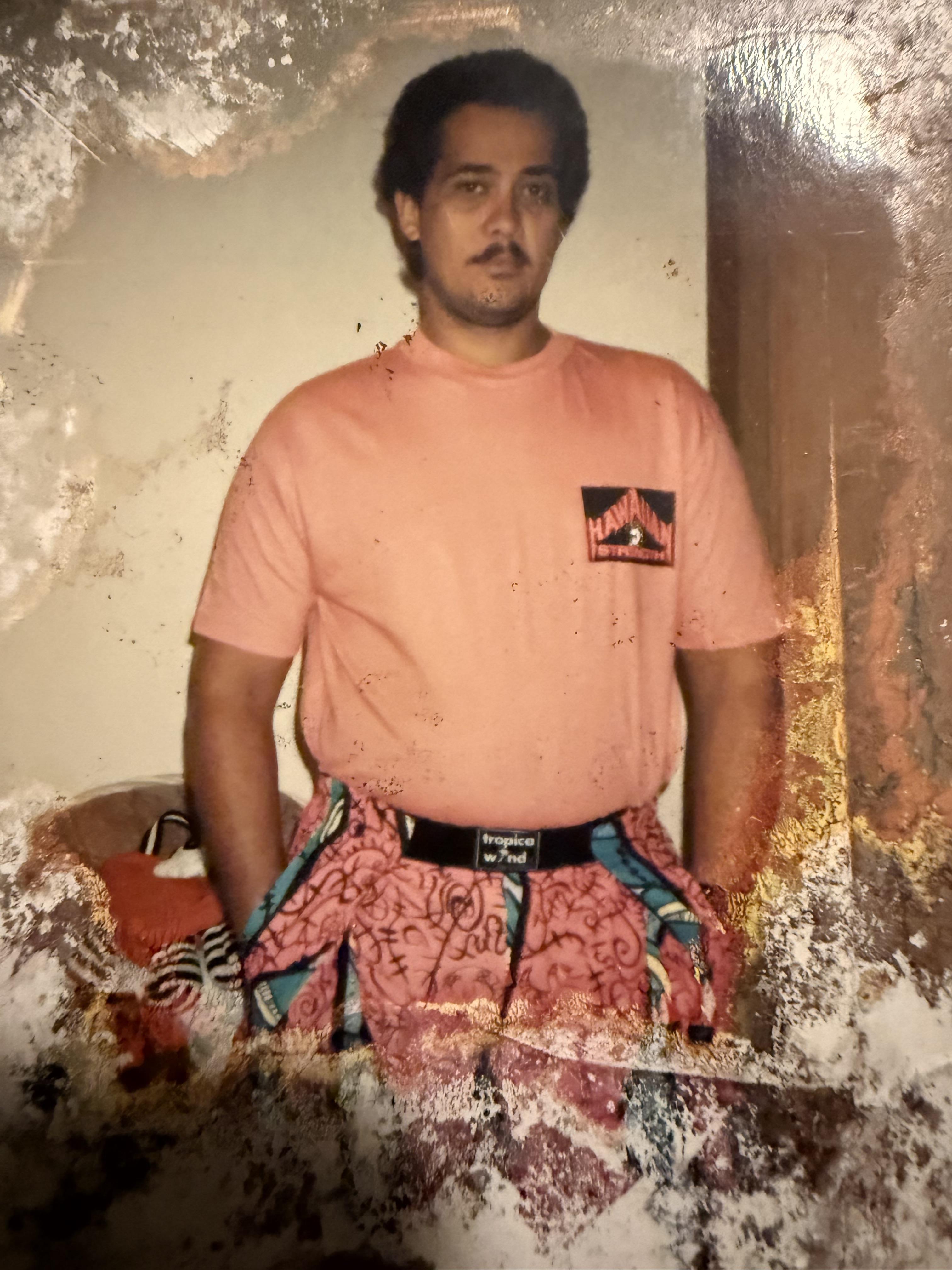 A man in a pink shirt