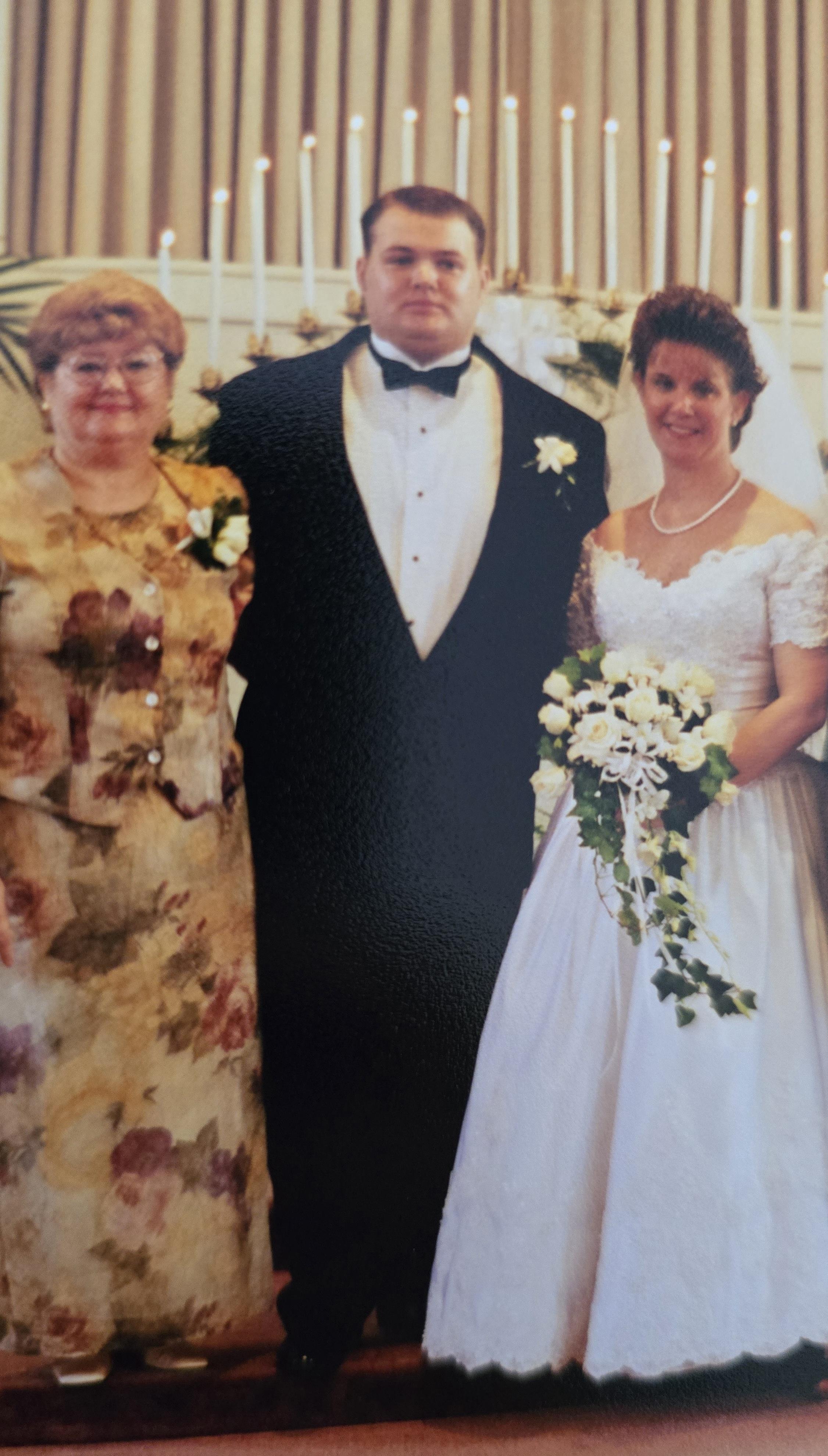 A man in a tuxedo and a woman in a wedding dress