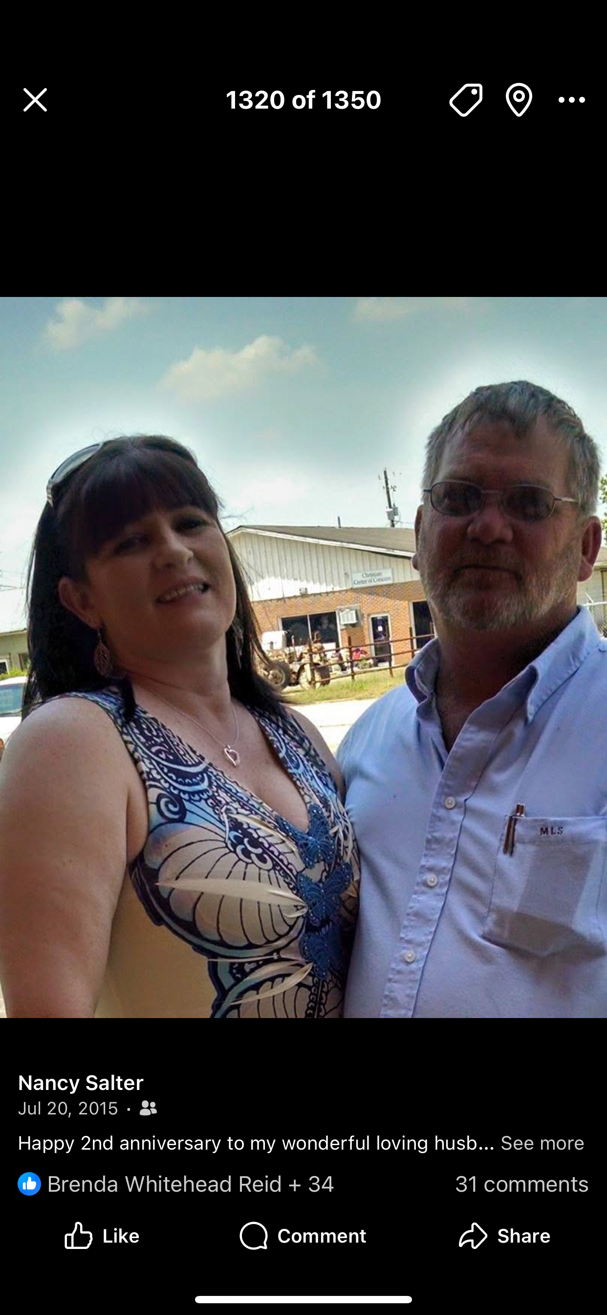 A man and woman posing for a picture
