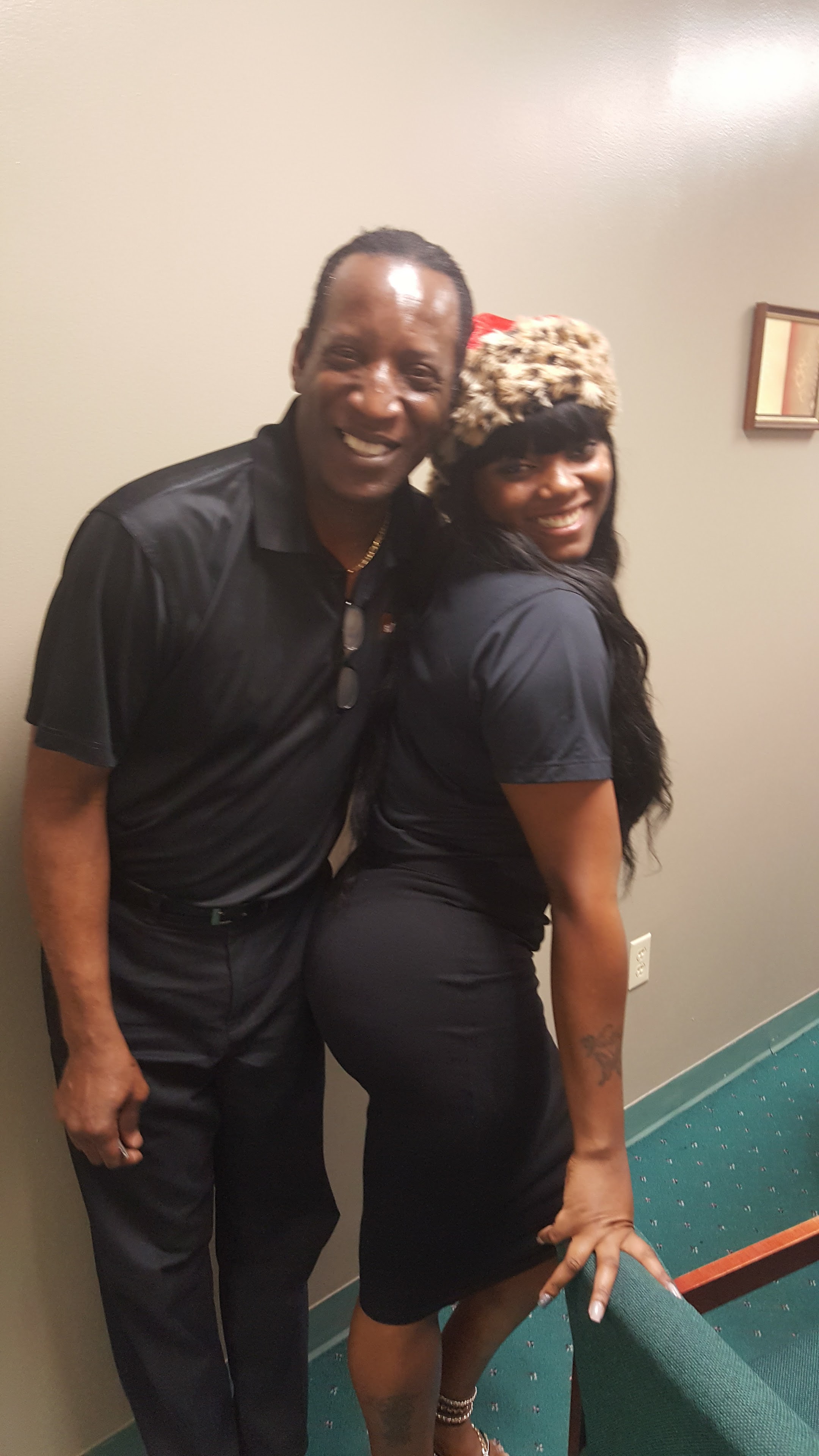 A man and woman posing for a picture