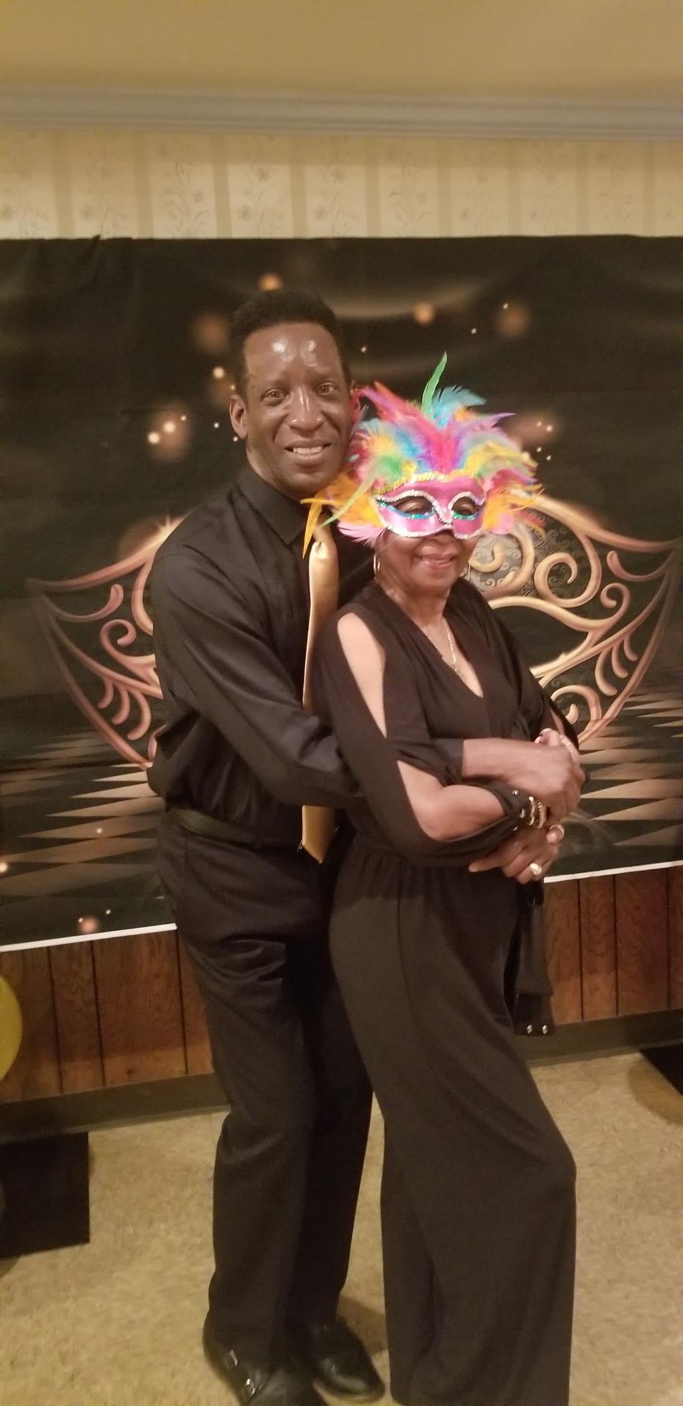 A man and woman posing for a picture