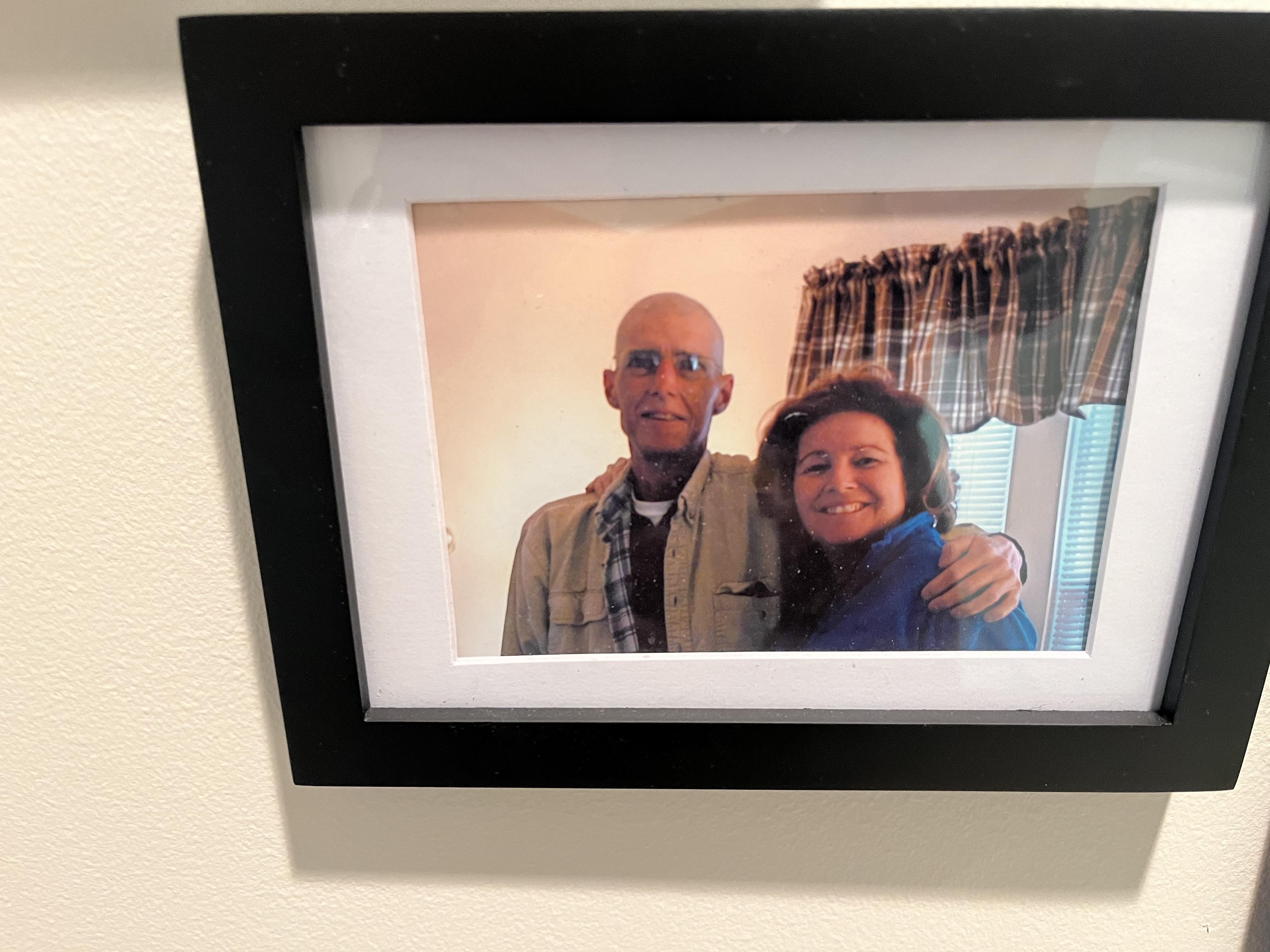 A man and woman in a picture frame