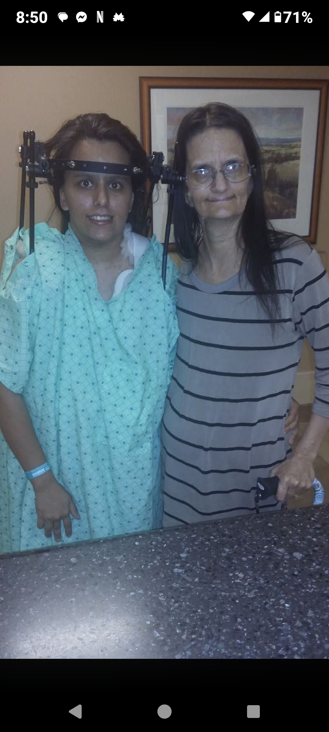 A woman standing next to another woman