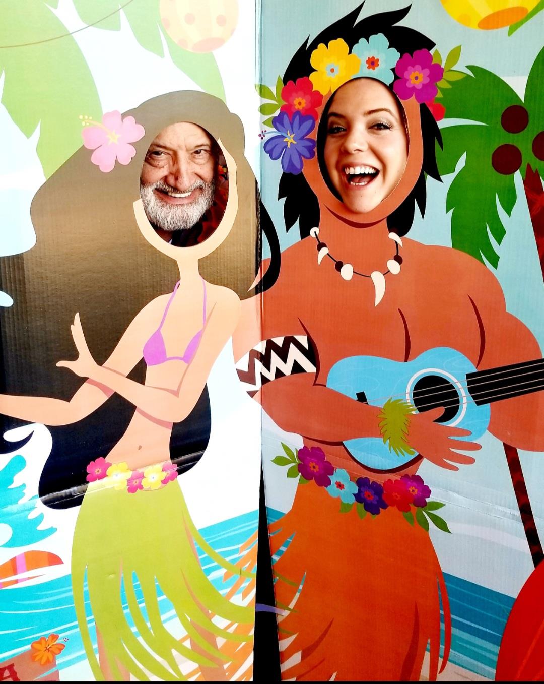 A man and woman cut out of cardboard