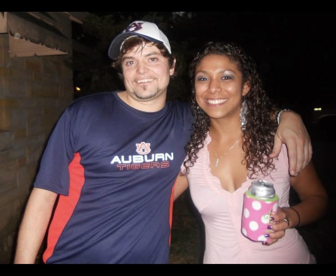 A man and woman posing for a picture