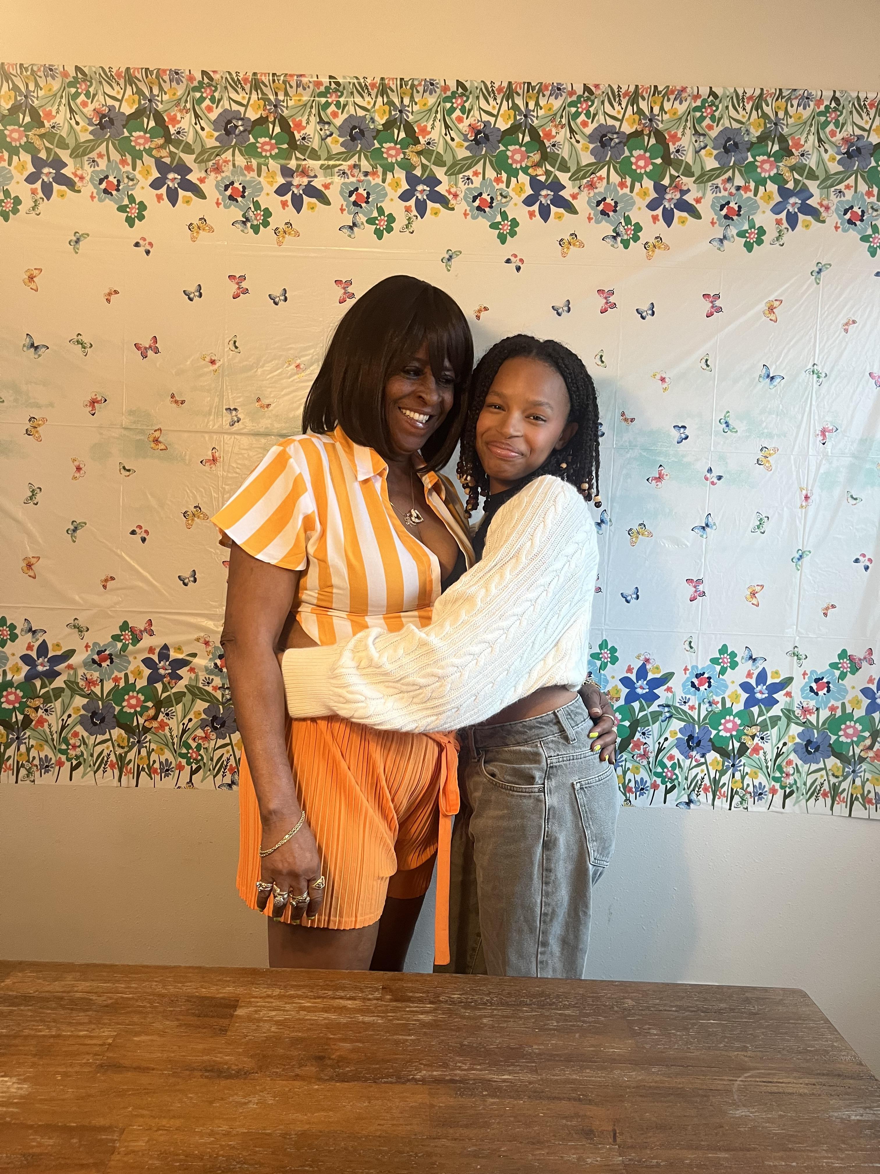 Two women hugging each other