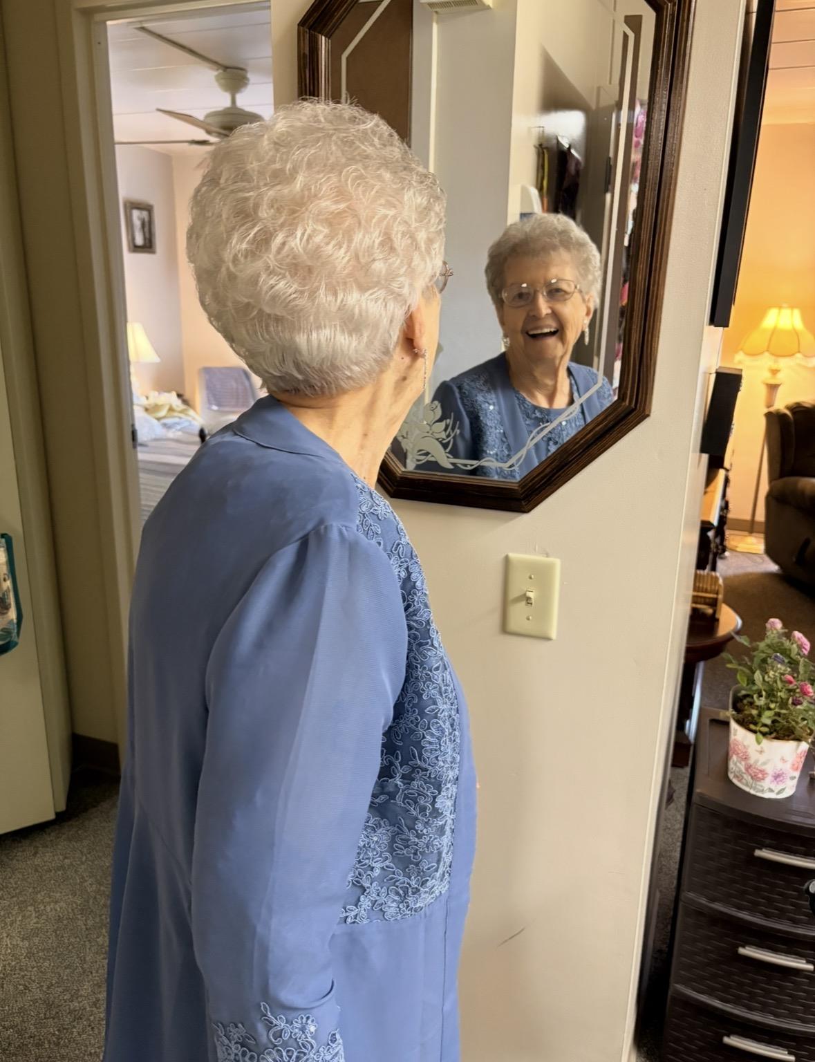 A woman looking at a mirror