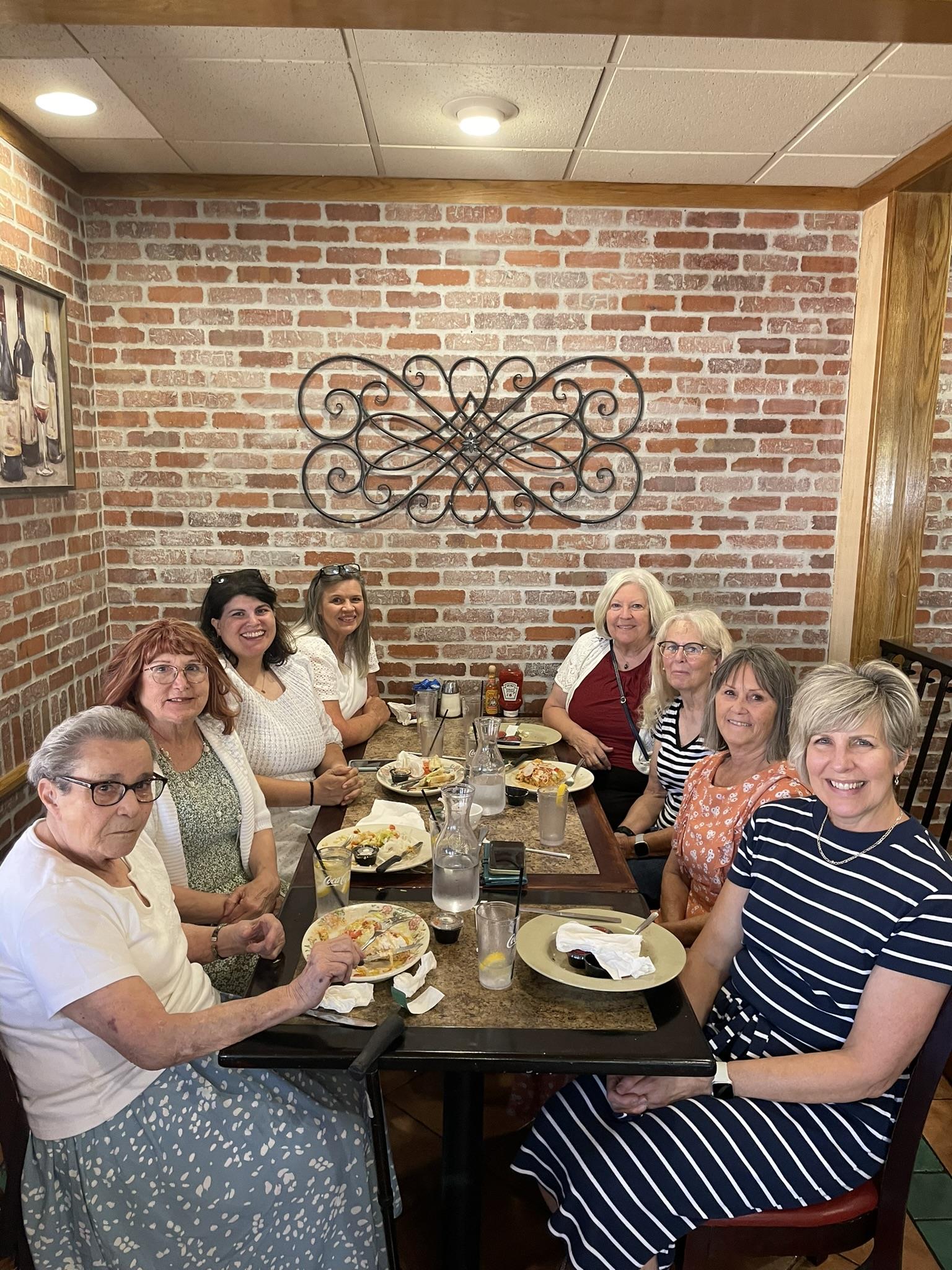 A group of women sitting at a table