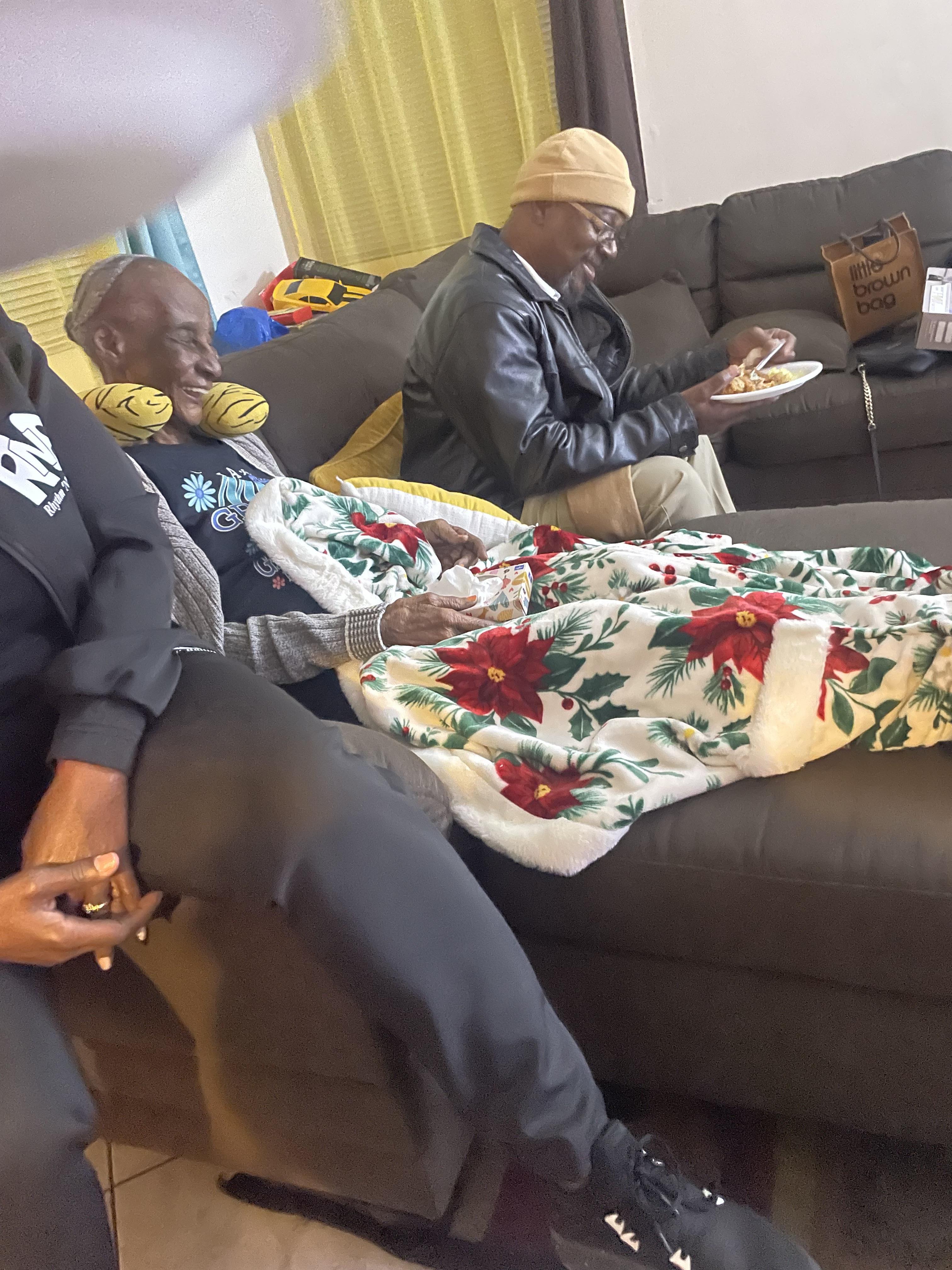 A group of people sitting on a couch