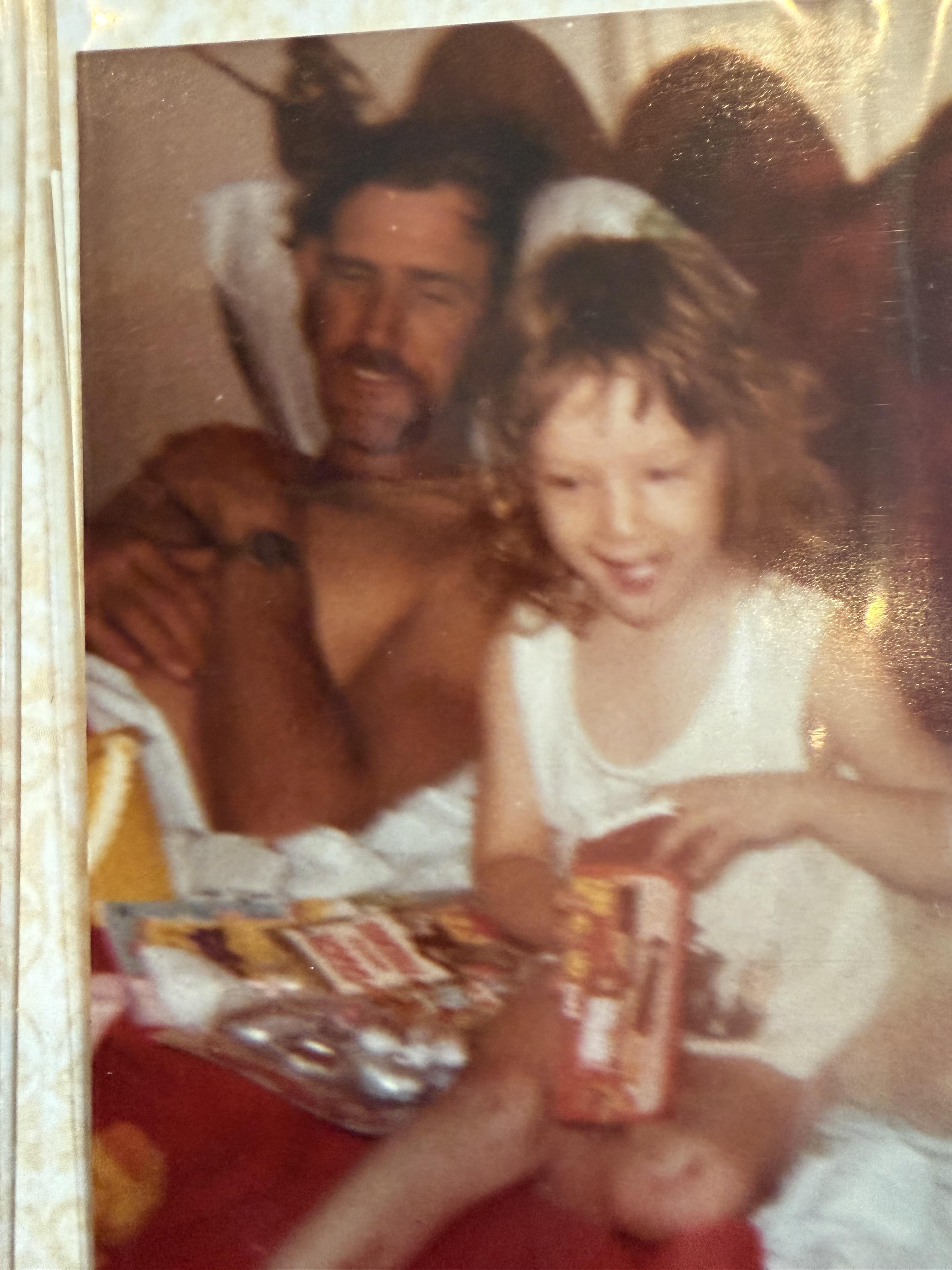 A man and a girl sitting at a table