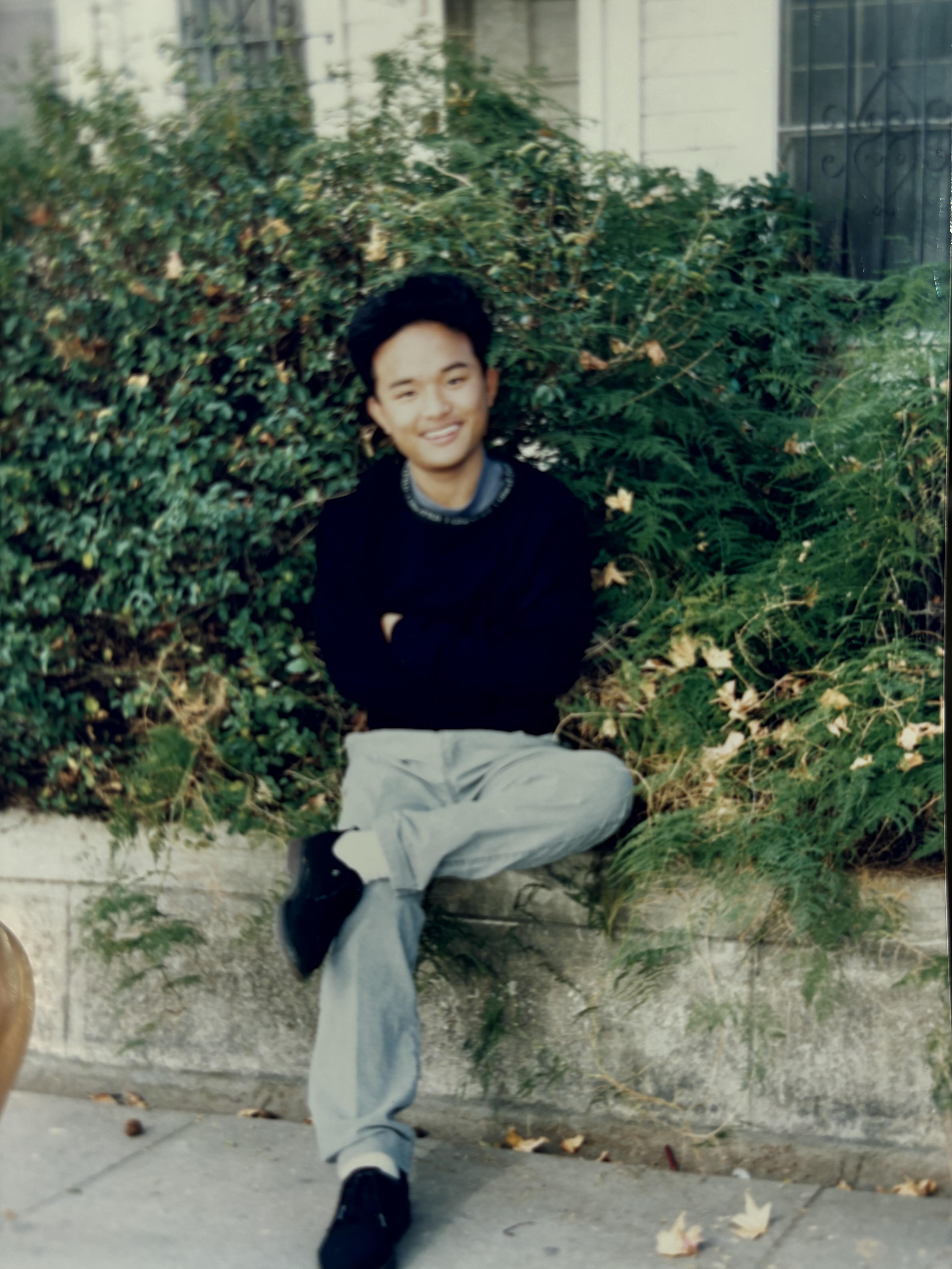 A man sitting on a ledge