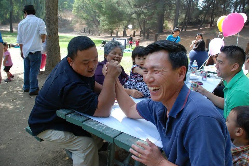 A group of people sitting at a picnic table