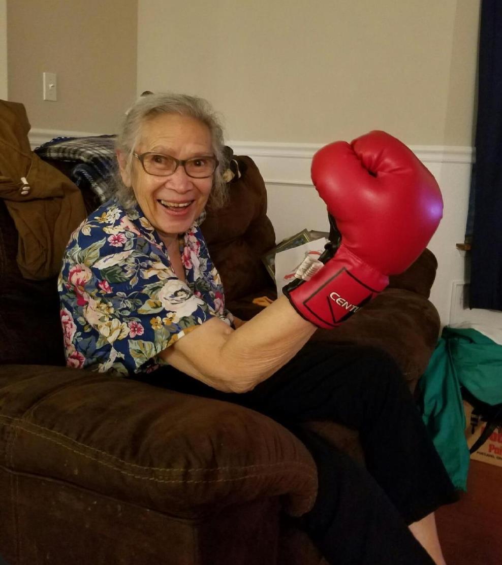 A woman wearing a boxing glove