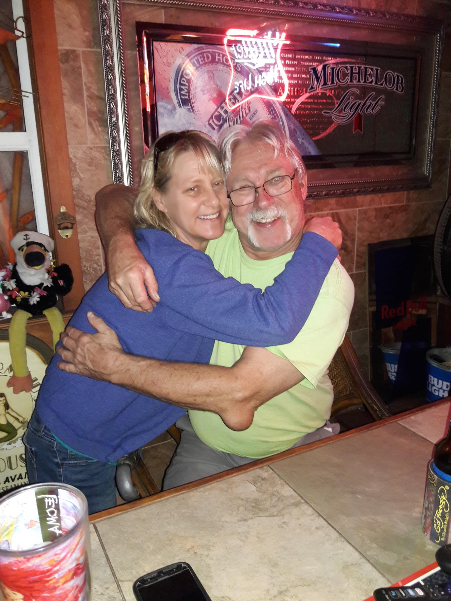A man and woman hugging