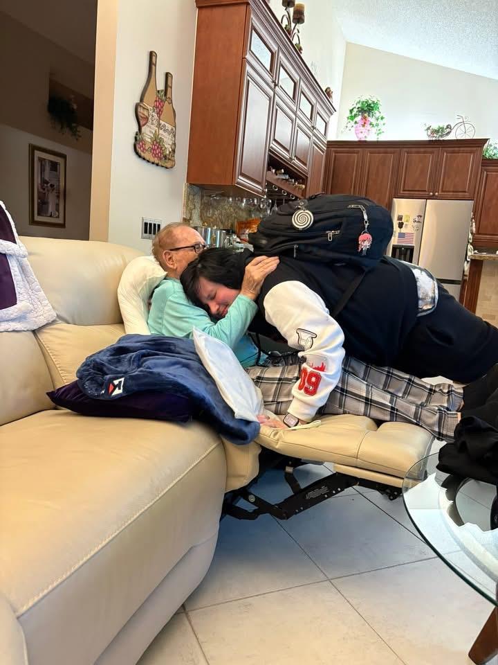 A man and woman lying on a couch