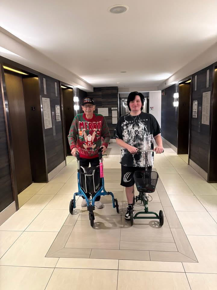 Two people in a hallway