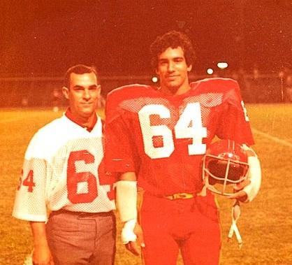 Two men wearing football uniforms