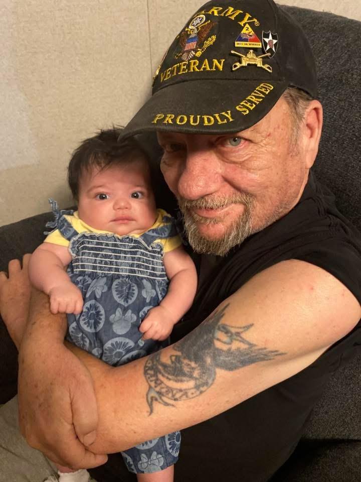 A man holding a baby
