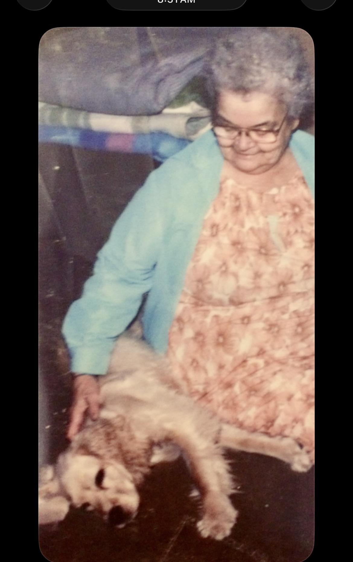 A woman holding a dog