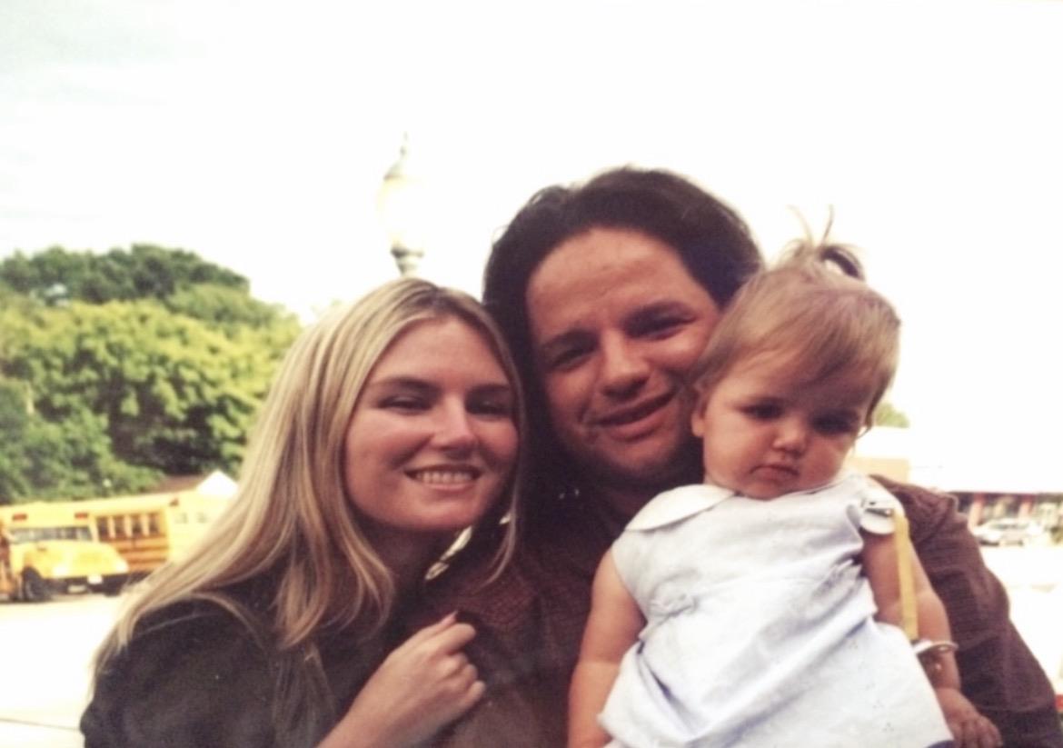 A man and woman with a baby