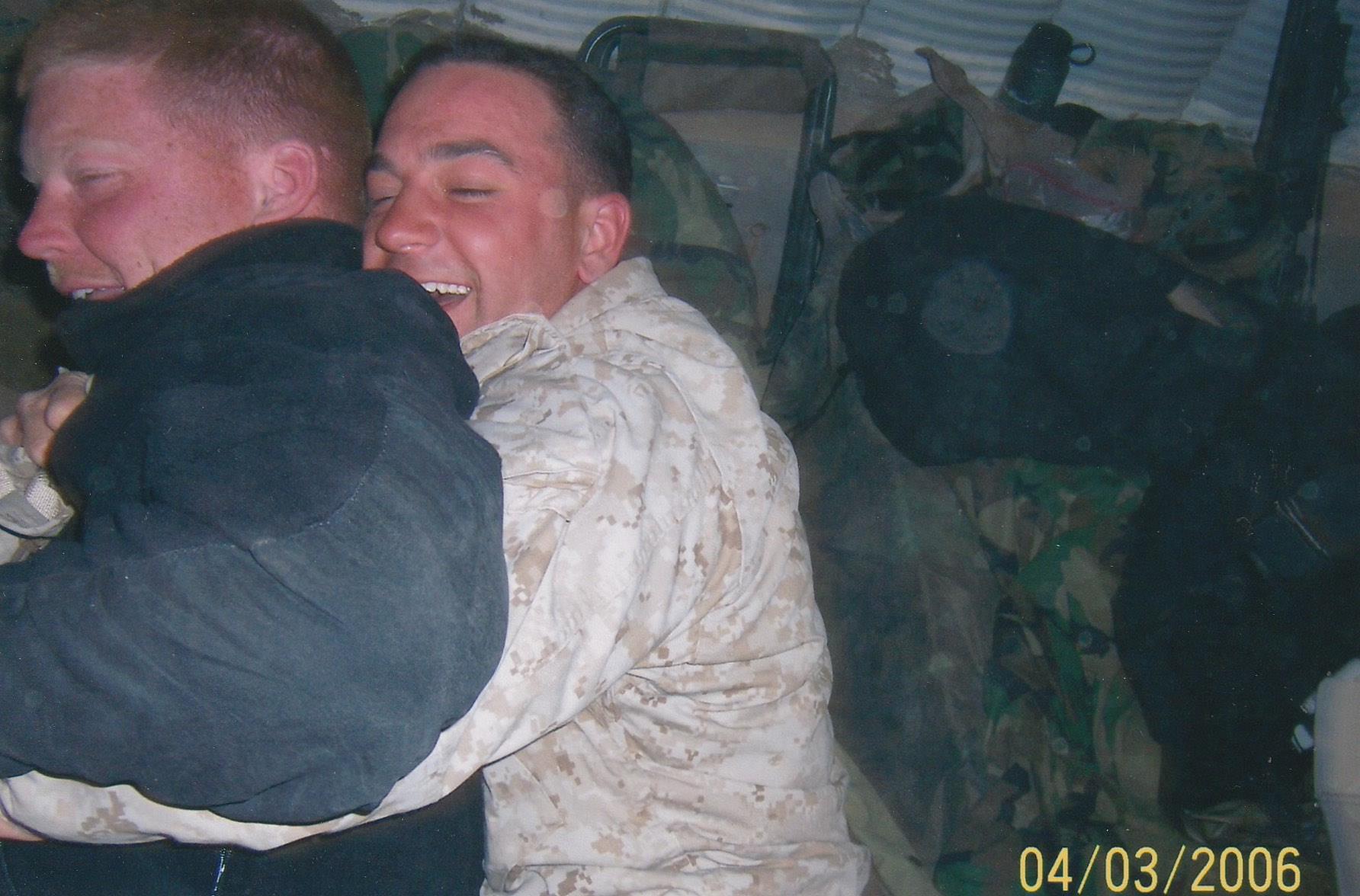 A man hugging another man