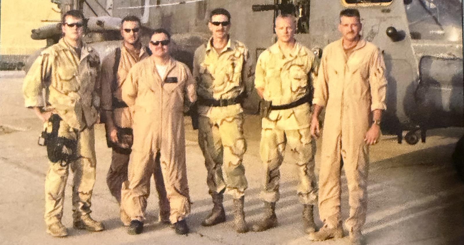 A group of men in tan overalls